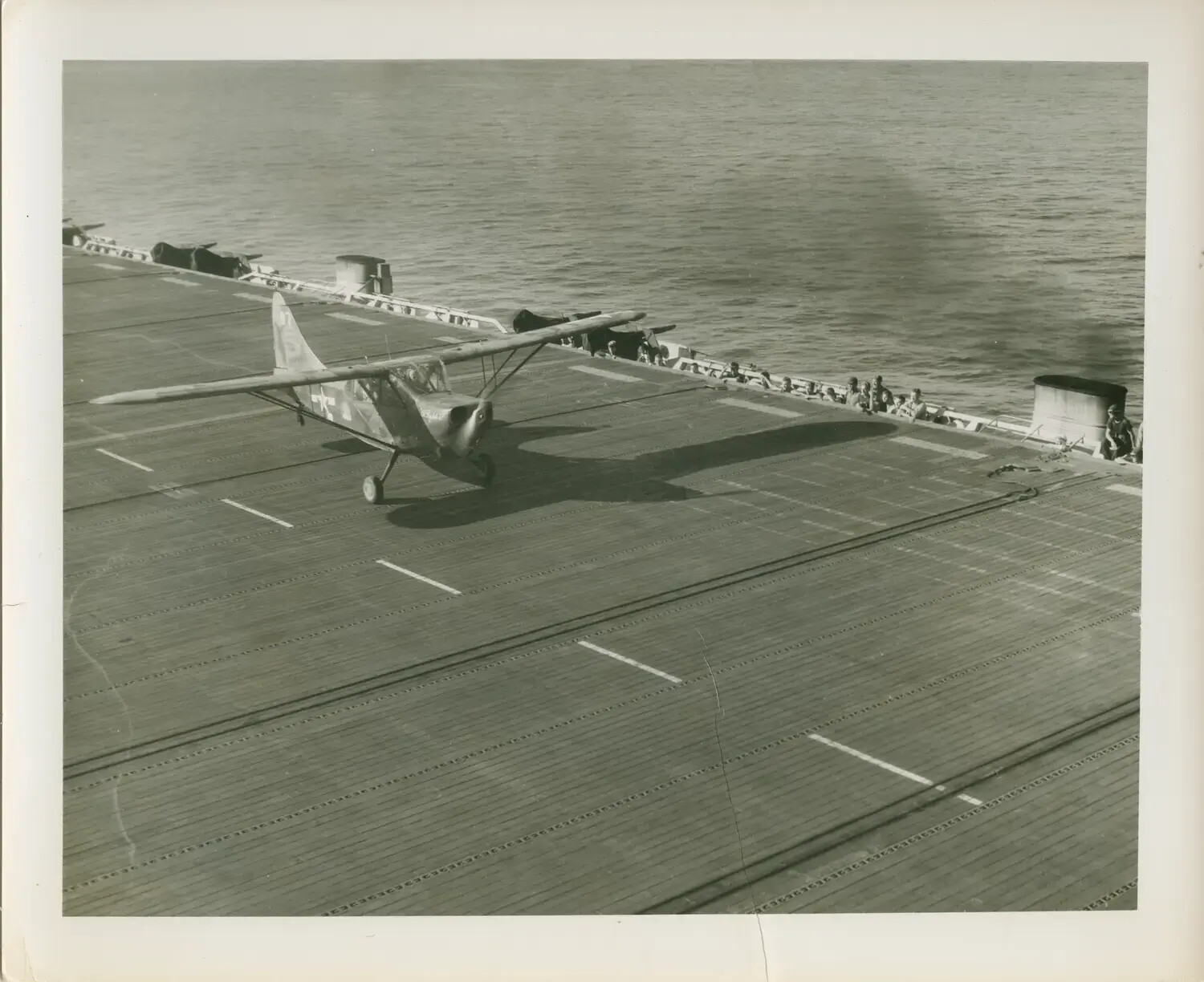 Liaison Aircraft on Flight Deck, USS Petrof Bay (CVE-80)