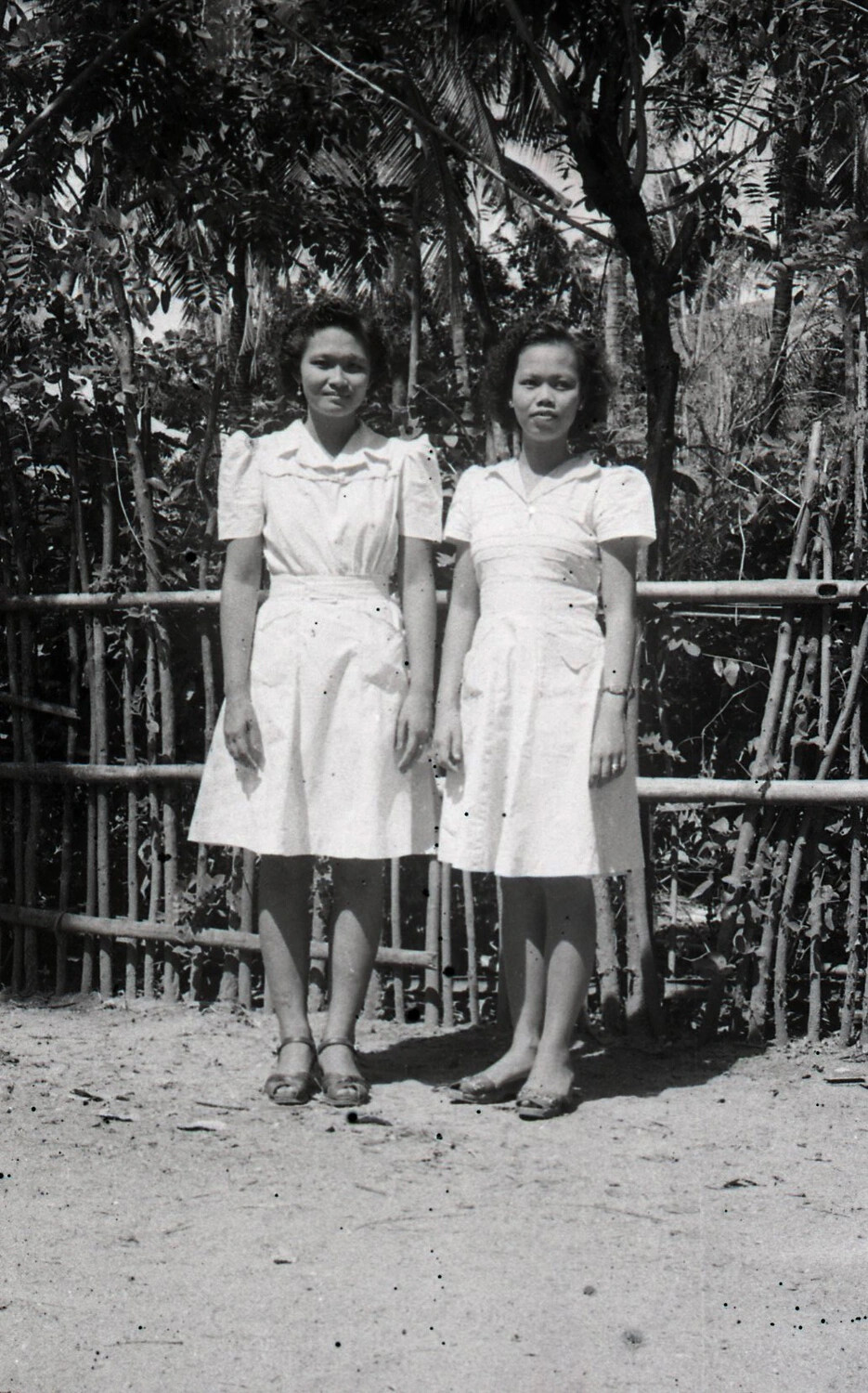 Two Young Filipino Women in Barrio, Luzon, Philippines, World War II Era