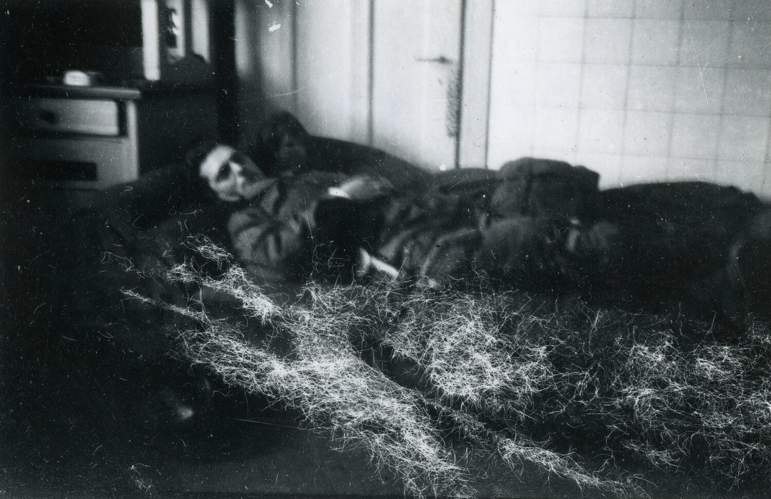American Soldier Resting on Improvised Straw Bedding, European Billet, WWII