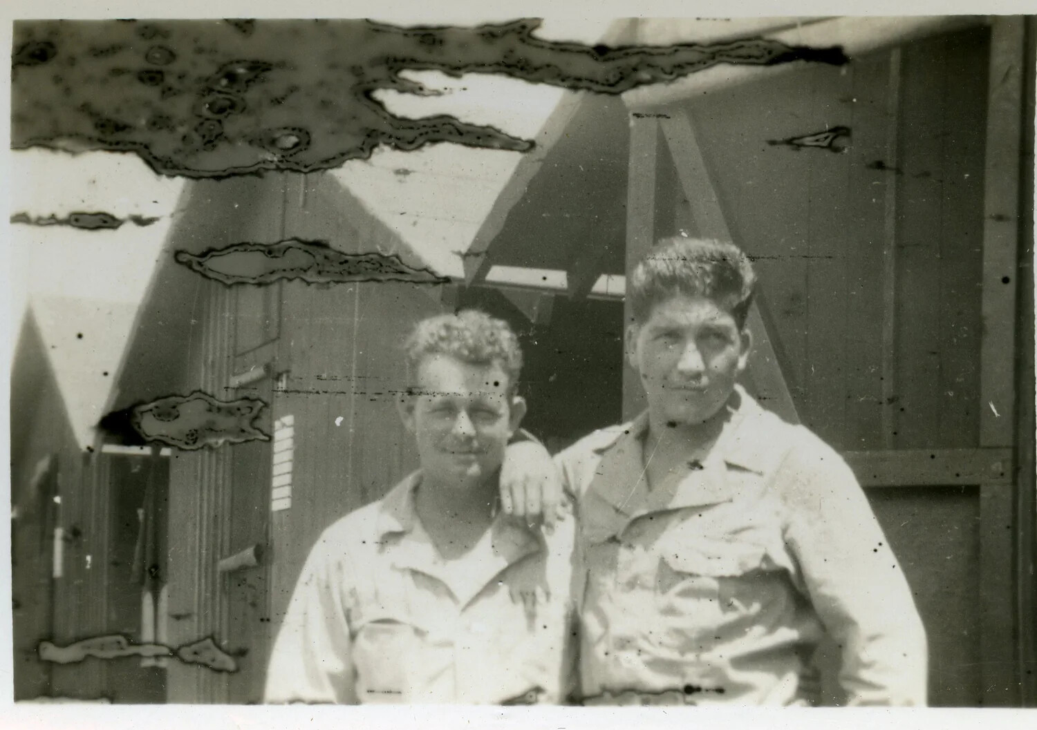 Two Servicemen in Front of Wooden Hut Structure, Joe Vieira Photo Collection