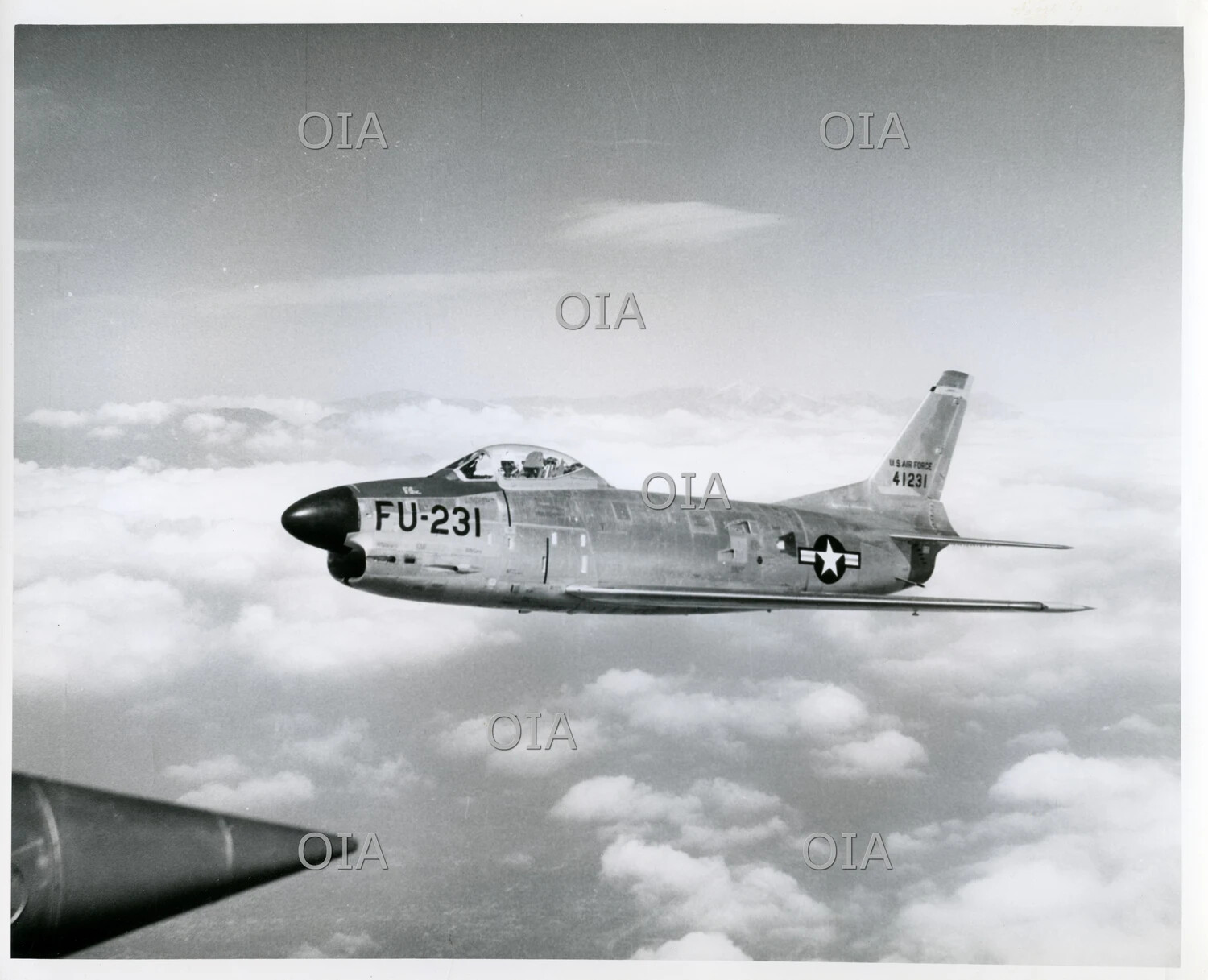 North American F-86D Sabre Dog All-Weather Interceptor (Serial 41231, FU-231) in Level Flight Above Clouds