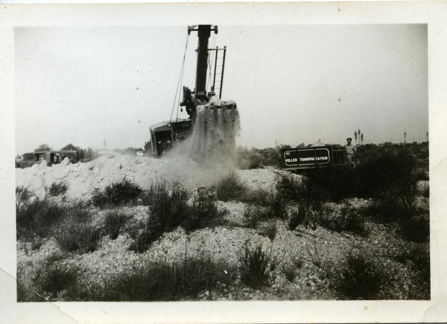 Steam Shovel Loading a Miller Transportation Truck at an Excavation Site