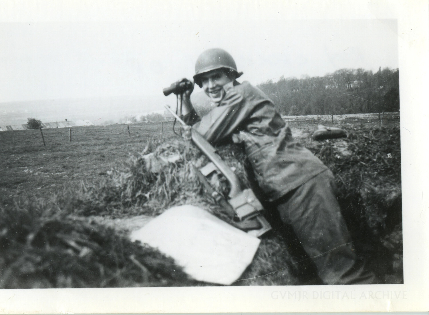 U.S. Paratrooper in a Foxhole with M1 Garand and Binoculars, European Theater, WWII
