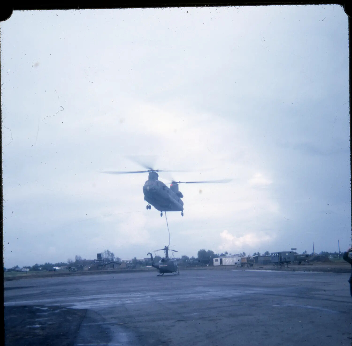 CH-47 Chinook Sling-Loading a UH-1 Huey Helicopter, South Vietnam, Vietnam War Era