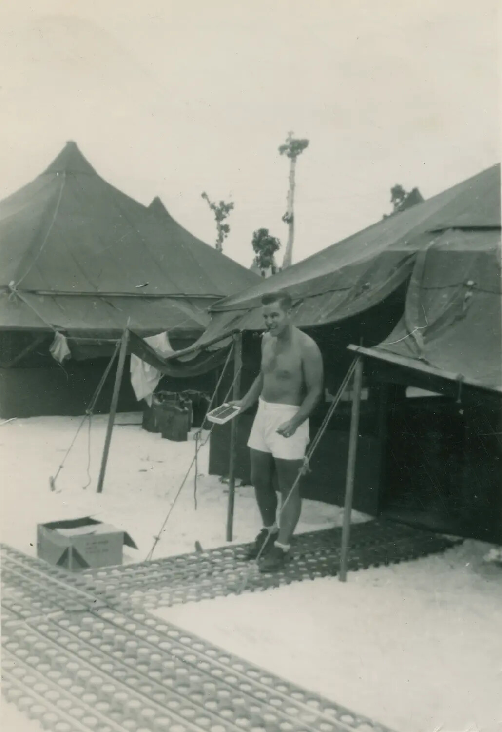 Serviceman at Tent Camp, Pacific Theater, WWII (McAleer Album)