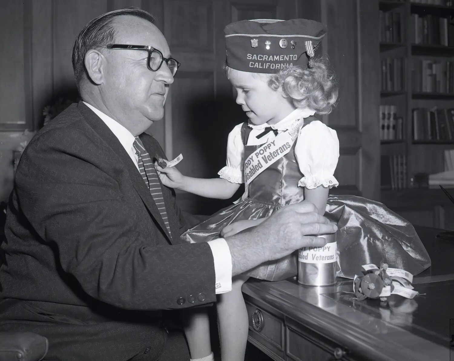 VFW 'Buddy Poppy' Campaign Presentation: Local Official and Child Poppy Volunteer, Sacramento, California (Alternate Angle)