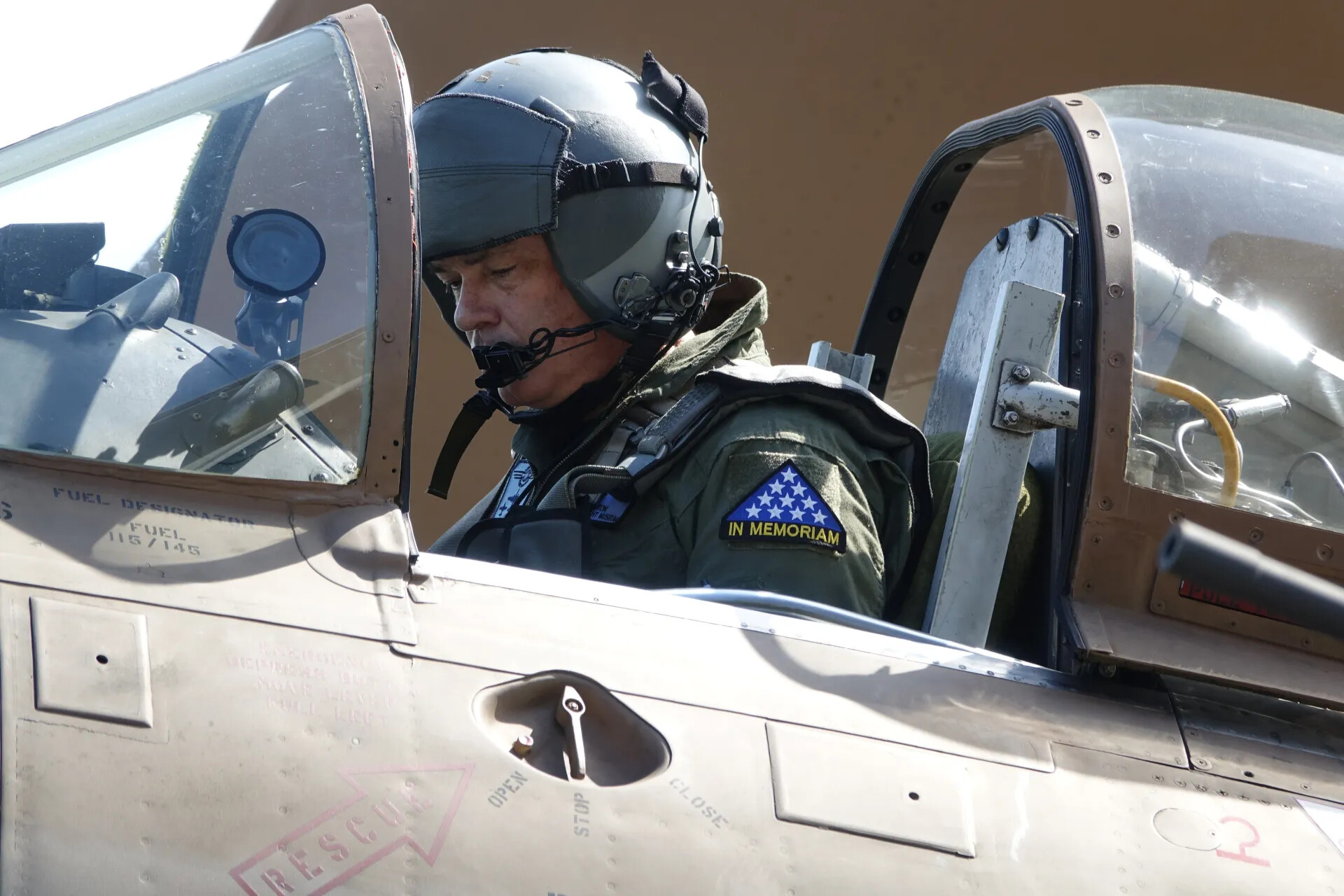 A-1 Skyraider Pilot in Leather Flight Helmet Beside 'RESCUE' Fuselage Stencil