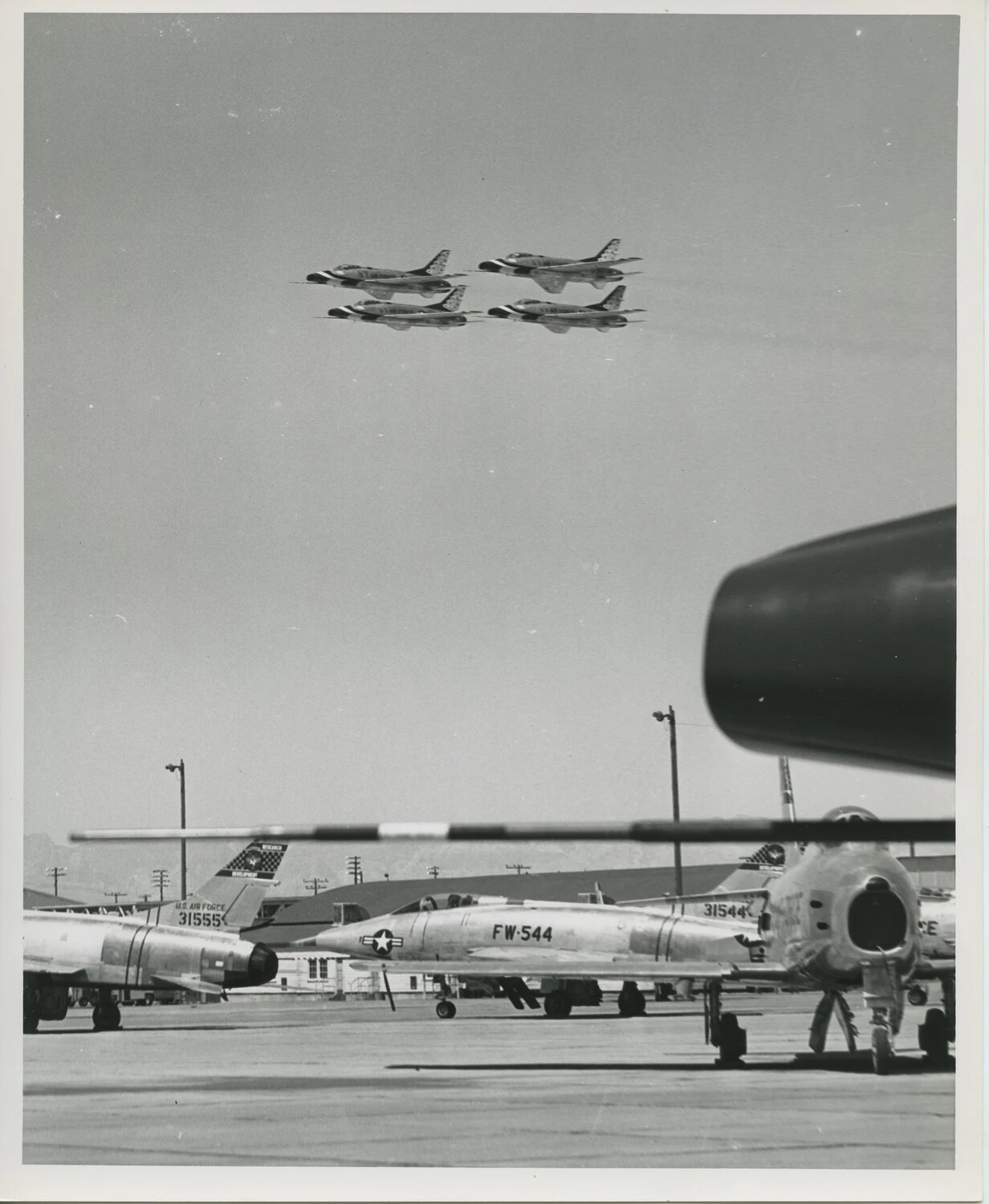 Thunderbirds Diamond Formation Overflying Parked Research and Development Aircraft