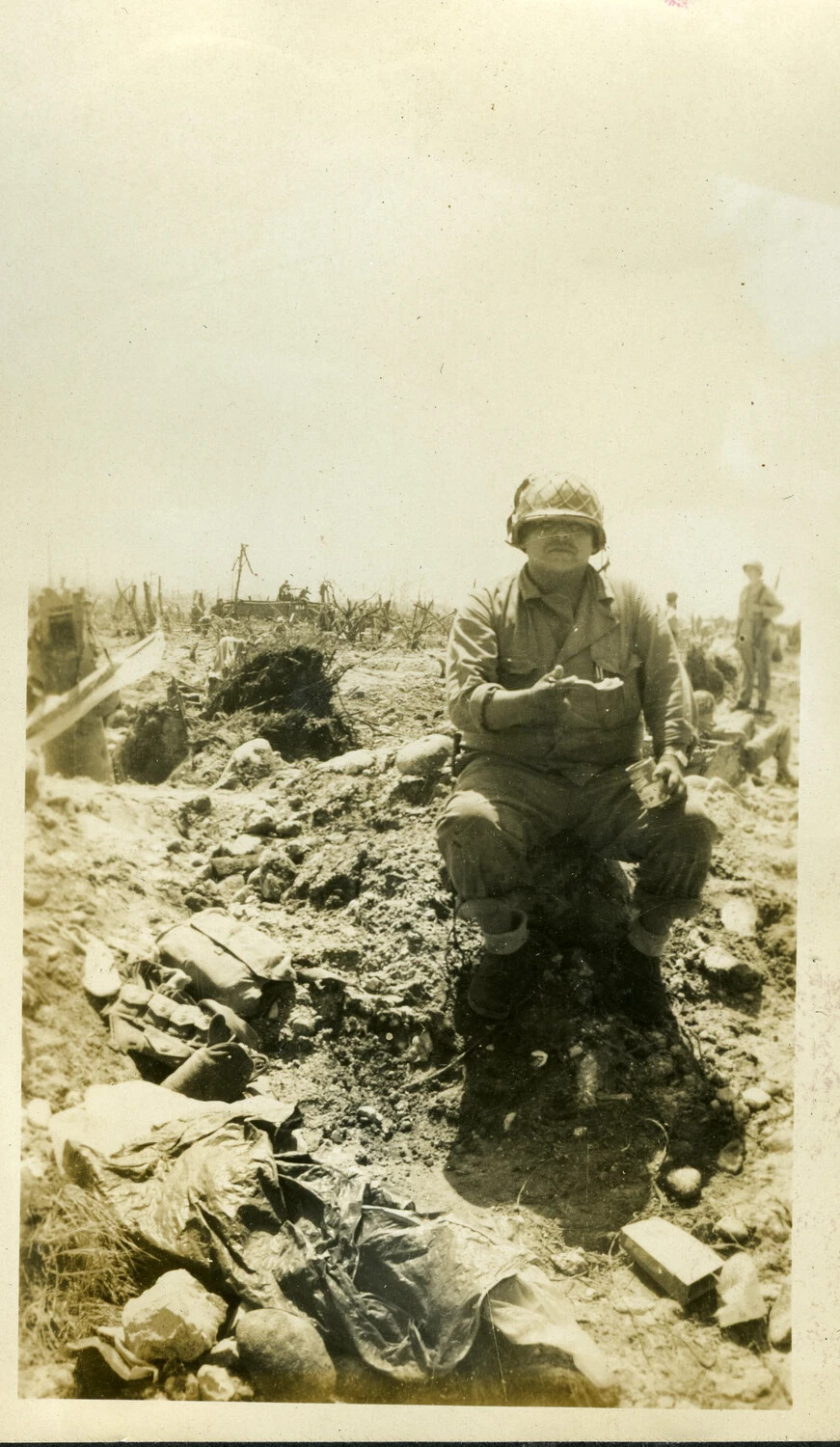 US Serviceman Resting Amid Battle Debris, Kwajalein Atoll, Marshall Islands, 1944