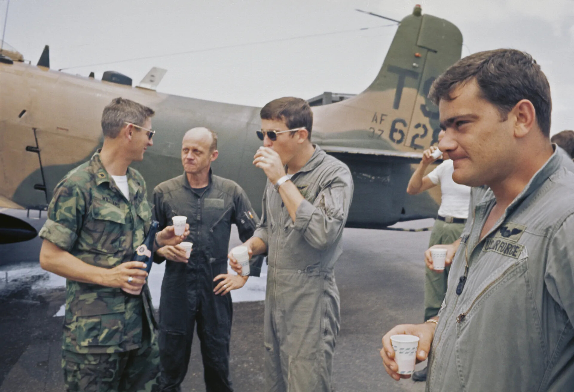 USAF Airmen Toast in Front of A-1 Skyraider, Tail Code TS, Vietnam War Era (Don Engebretsen Slide Collection)