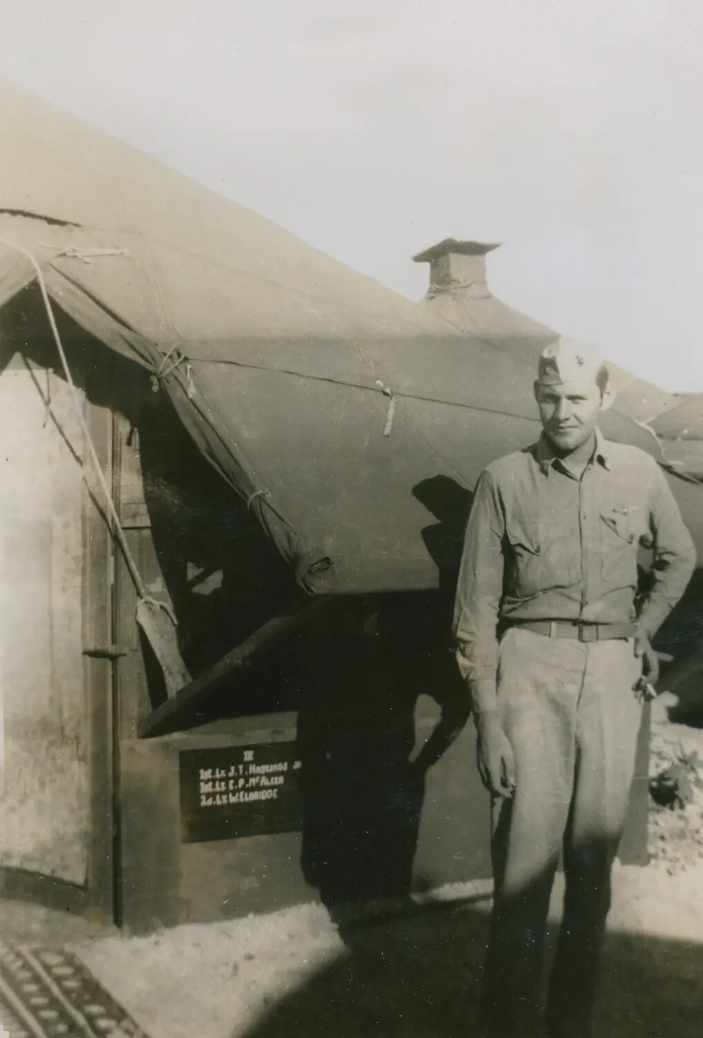 Officer Outside Tent Quarters Marked with Name Board Including Lt. E.P. McAleer, World War II