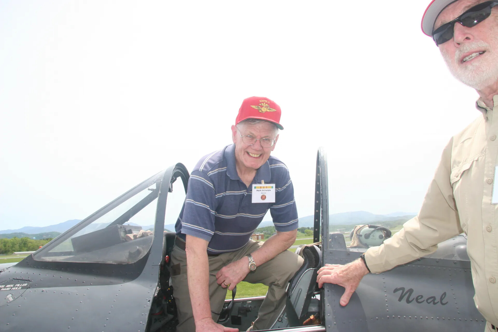 Mark McKenzie Climbing into Cockpit of T-28-Type Aircraft "Neal," Operation Tailwind Event