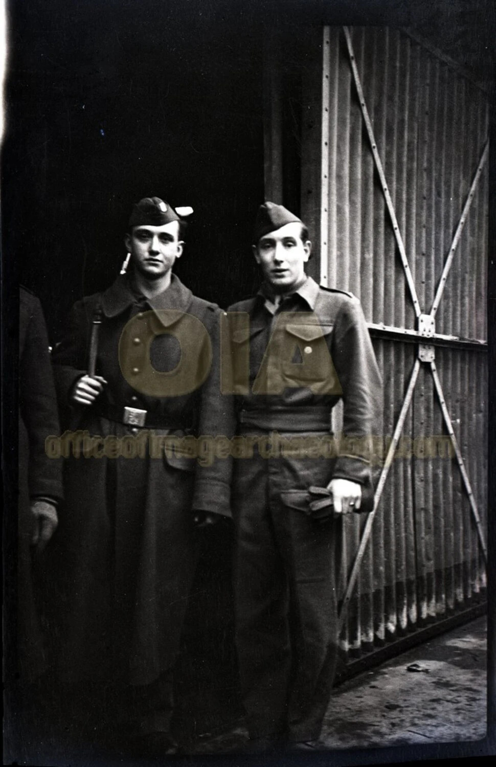 Two Servicemen Before a Corrugated Metal Gate, Bremerhaven