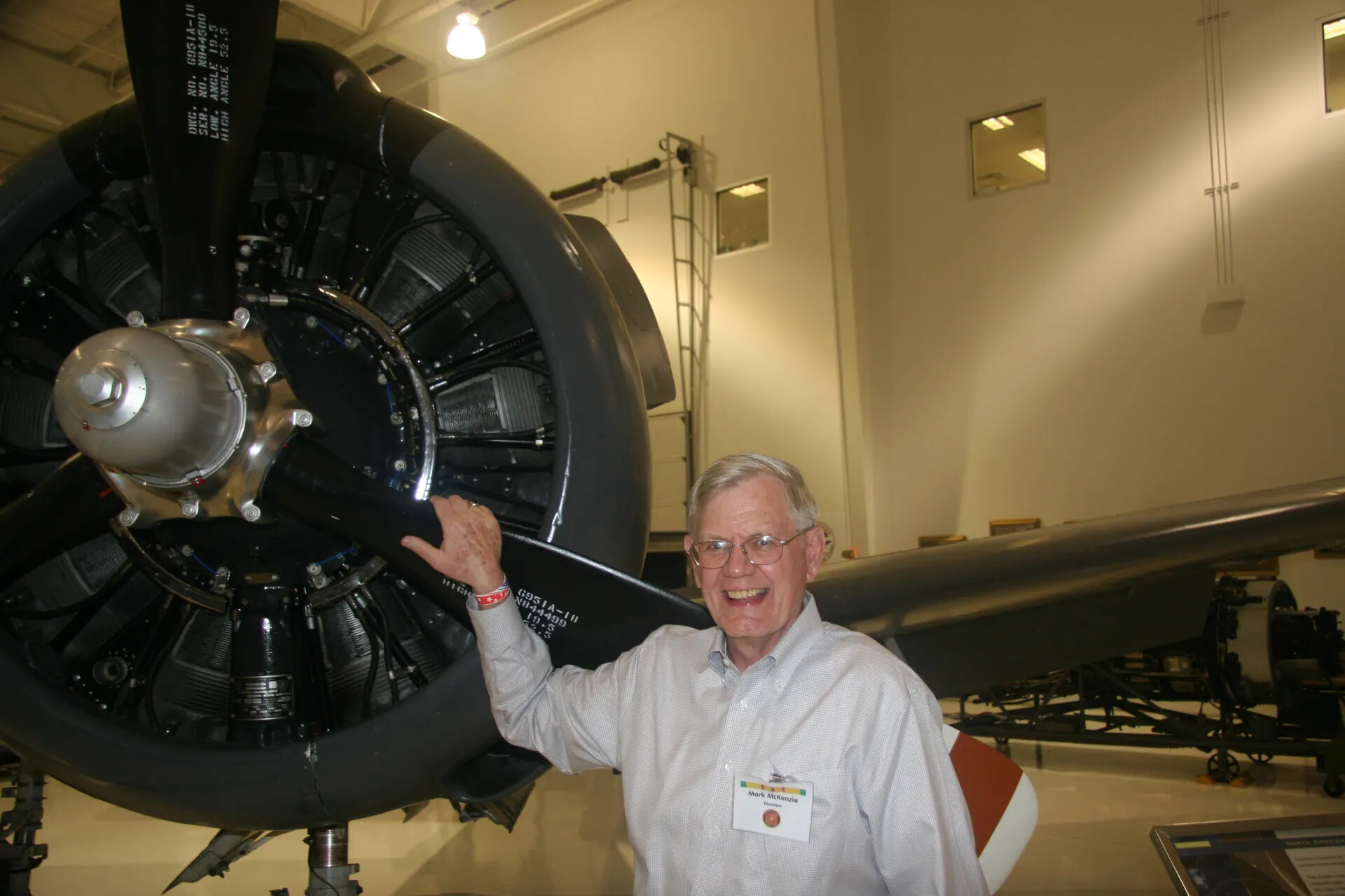 Visitor Mark McKenzie Beside Large Radial Engine and Propeller, Aviation Museum Display