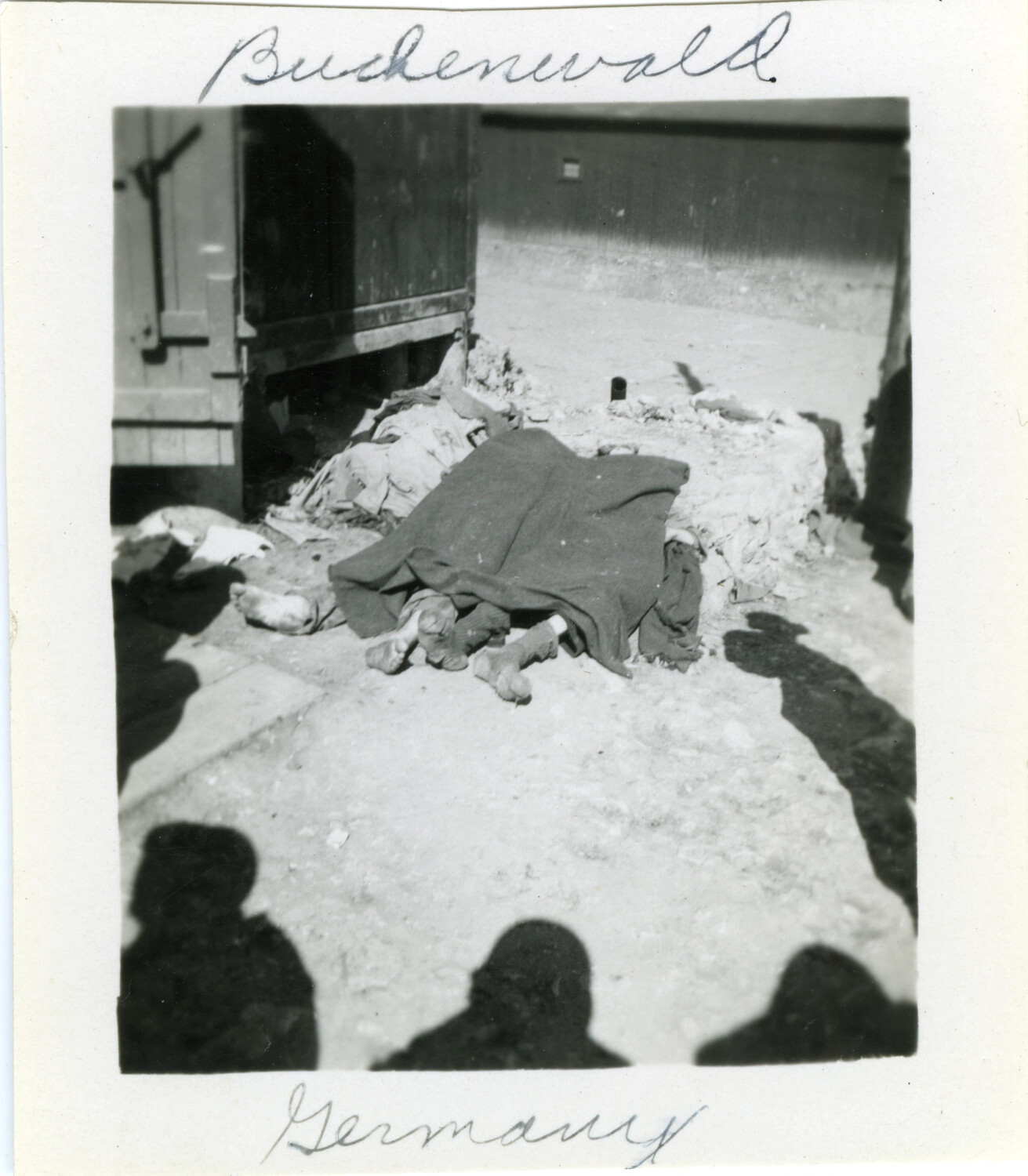 Victims' Remains Beside Rail Car at Buchenwald Concentration Camp, Germany, April 1945