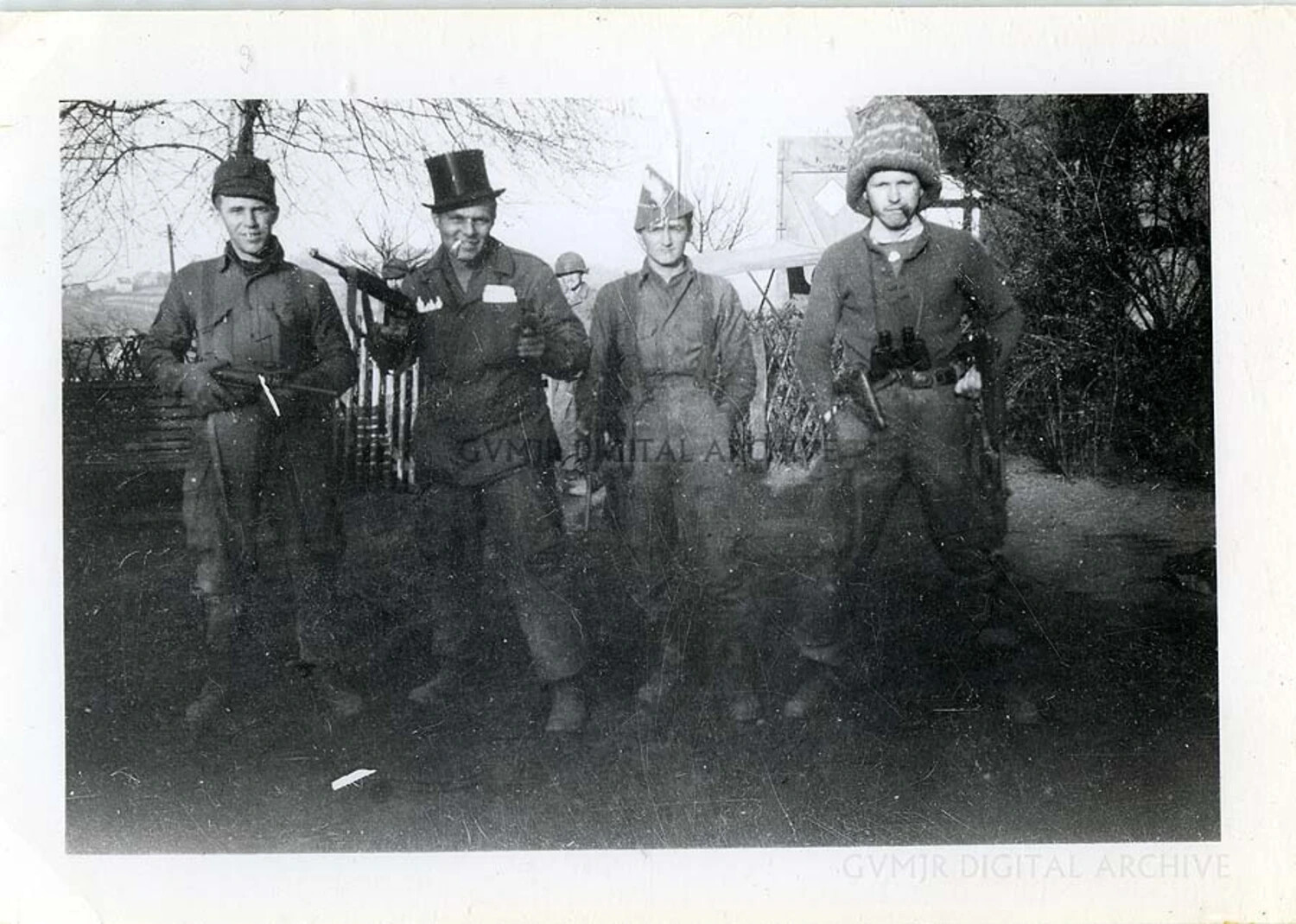 Paratroopers Display a Captured German MP40 Submachine Gun in Improvised Winter Dress, Likely Battle of the Bulge, WWII