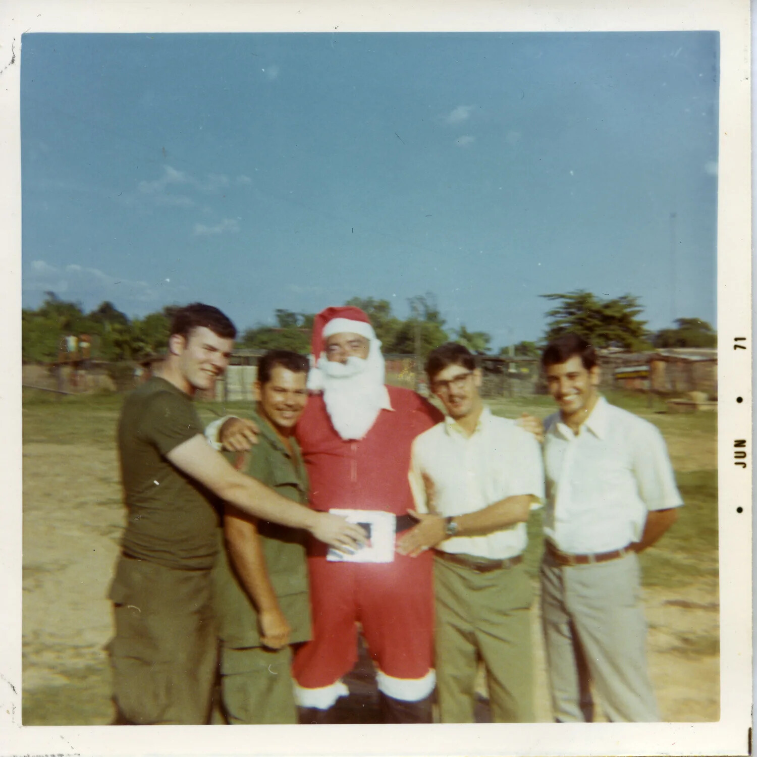 Five Servicemen Posing with a Man in a Santa Claus Costume, Vietnam, 1971