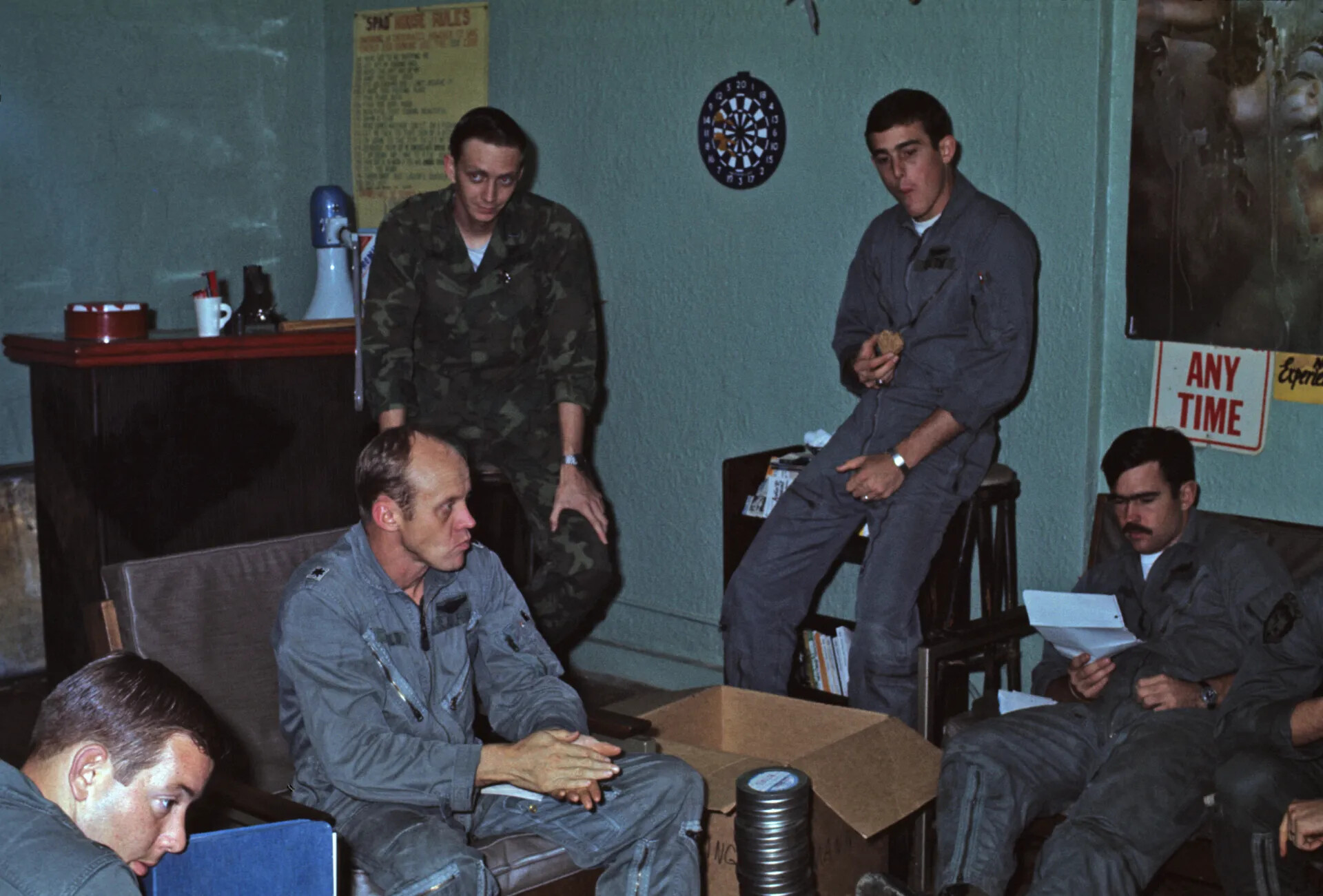 Squadron Aircrew Relaxing in Ready Room Beneath 'Spad House Rules' Poster