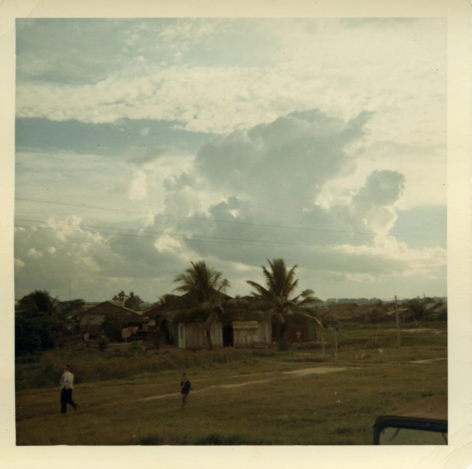 Rural Village Scene with Palm Trees and Cumulus Clouds, Vicinity of Saigon, South Vietnam, 1964