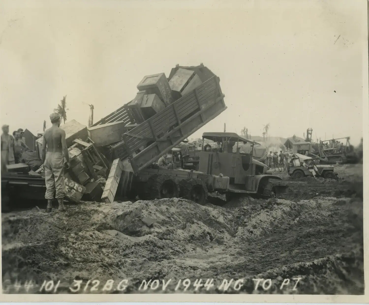 Dump Truck Unloading Supply Crates at Muddy Depot, 312th Bombardment Group, November 1944