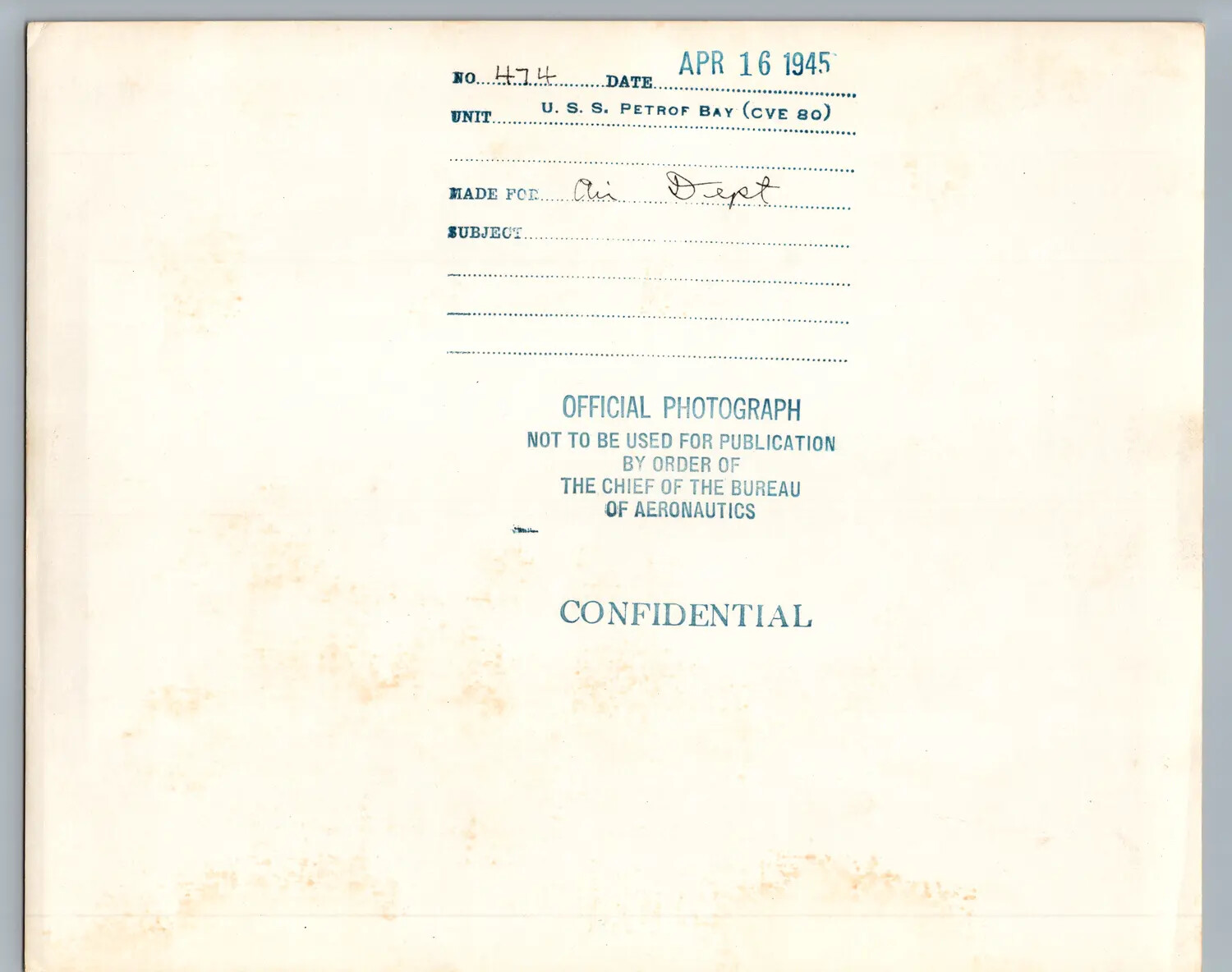 Verso Caption Card of Official U.S. Navy Photograph No. 474, U.S.S. Petrof Bay (CVE-80), April 16, 1945, Confidential