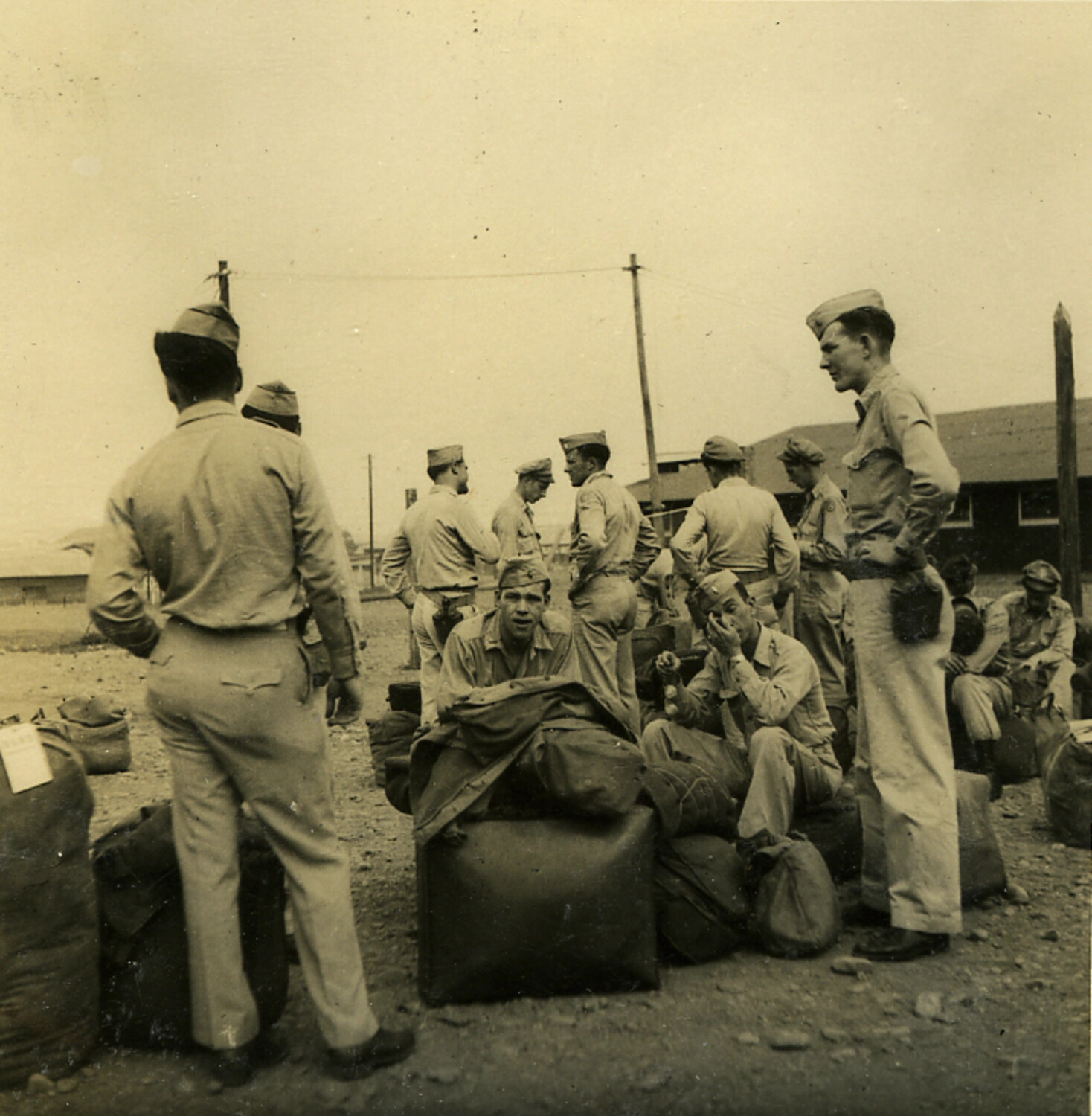 American Servicemen with Duffel Bags Awaiting Transport, Occupation-Era Japan