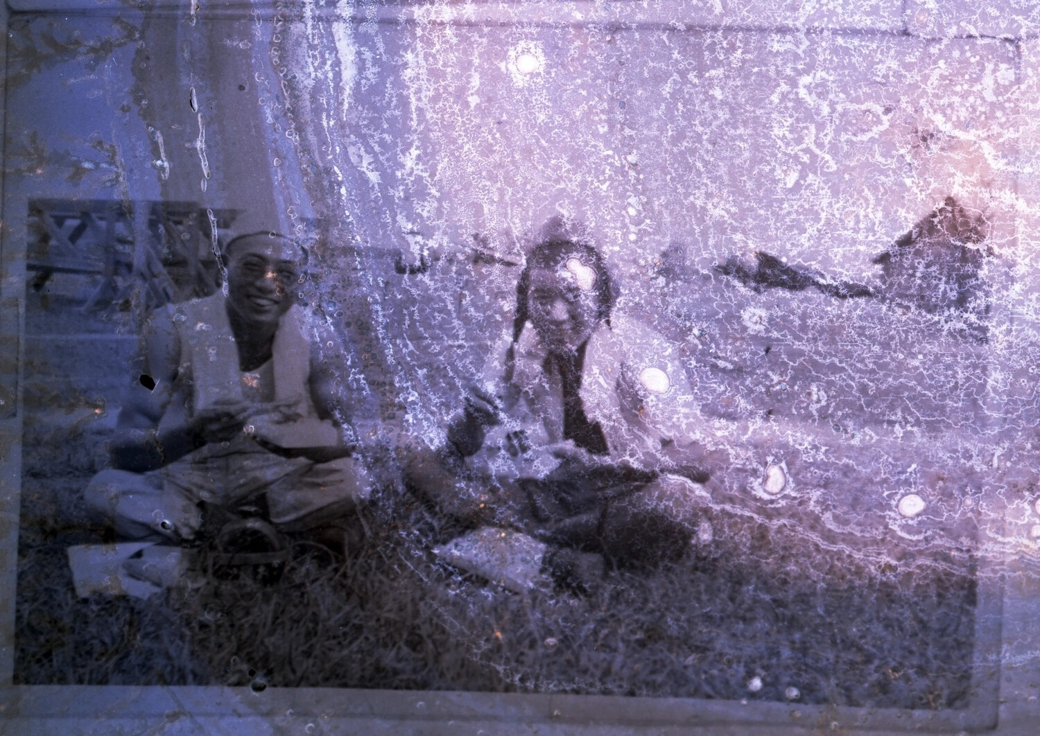 Deteriorated Negative of Two Seated Men, China-Burma Theater Collection, WWII