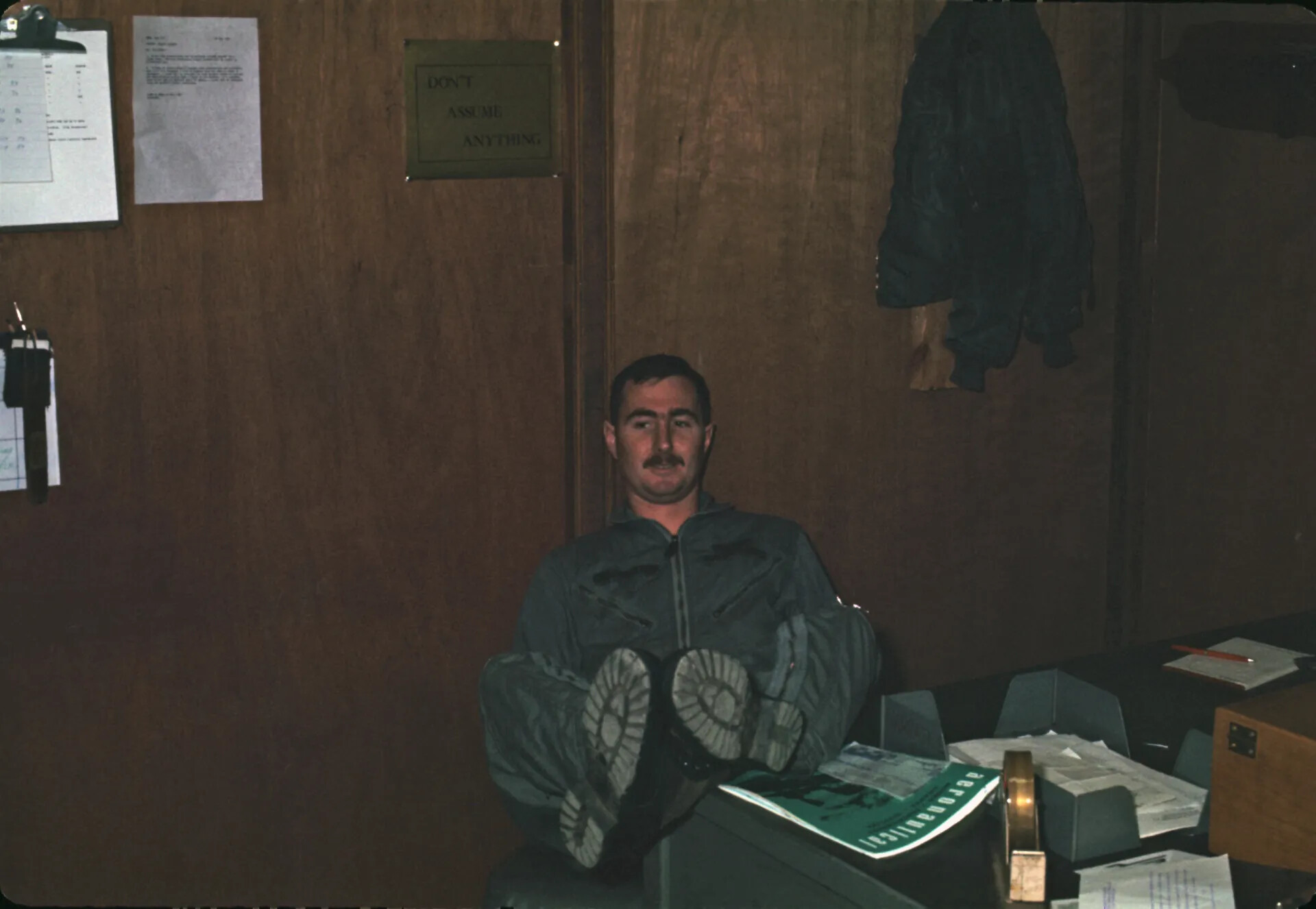 USAF Pilot Relaxing with Feet on Desk, Squadron Office