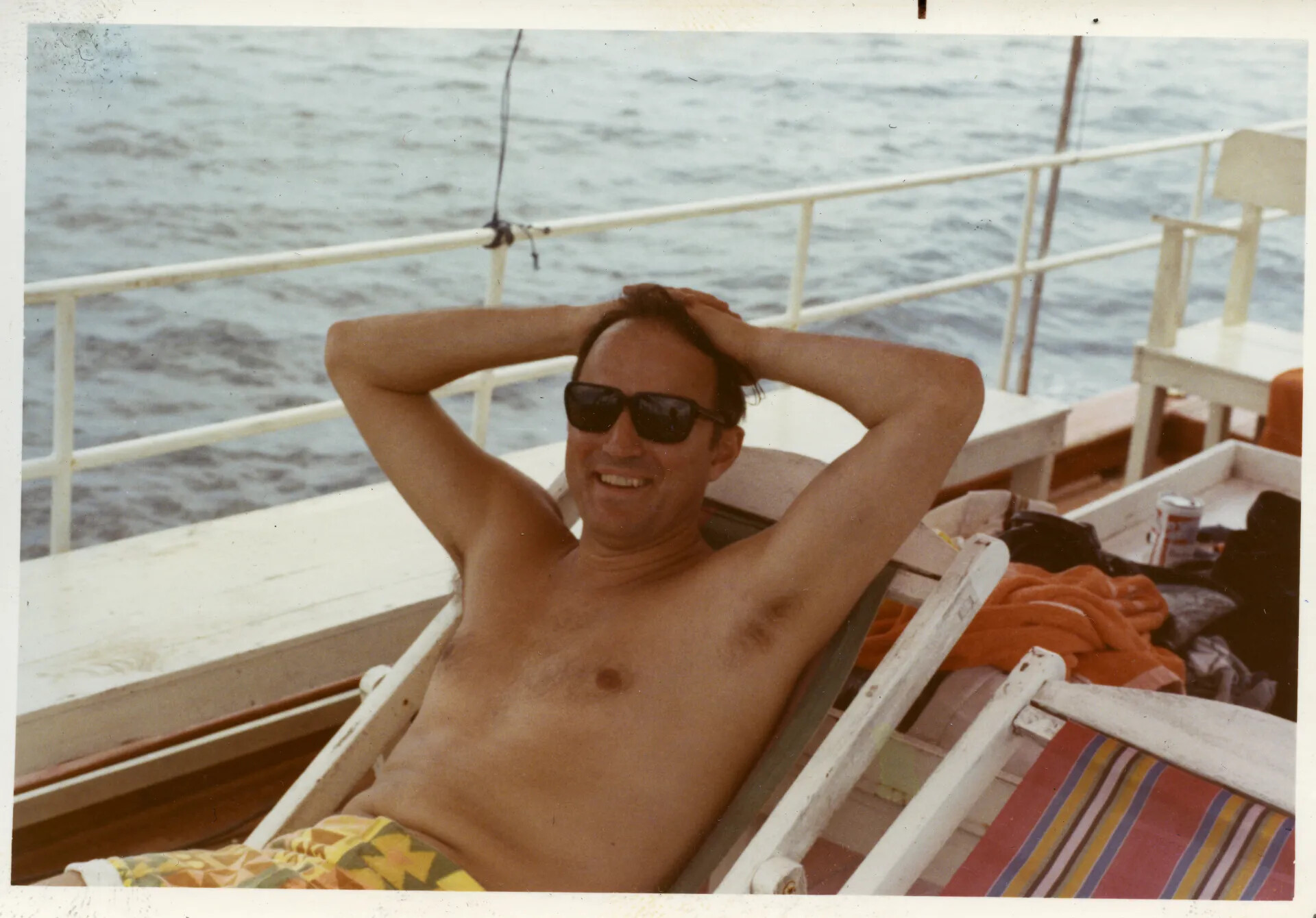 Man Relaxing in Deck Chair Aboard Boat, Thailand R&R Trip, Vietnam War Era
