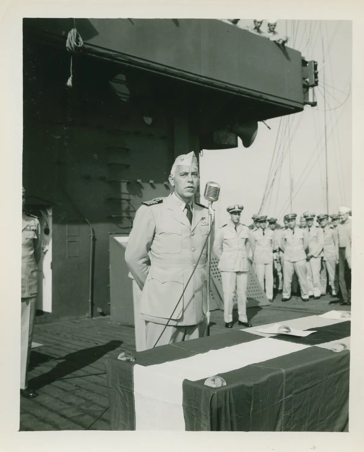 Naval Officer Addressing Crew During Shipboard Ceremony, USS Petrof Bay (CVE-80)