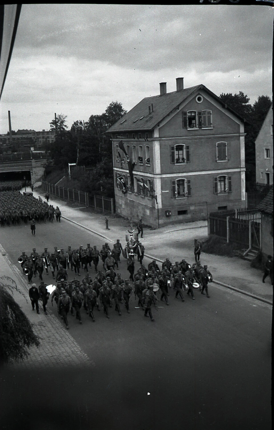 German Military Band Leading Infantry Column Through Town Street, World War I Era