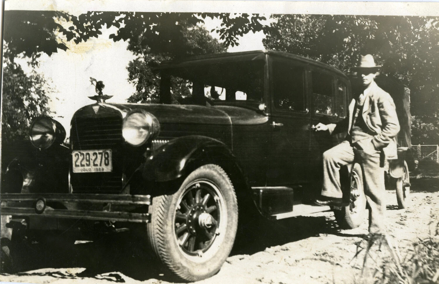 Man Beside 1920s Touring Sedan with Colorado 1928 License Plate, Rural Roadside