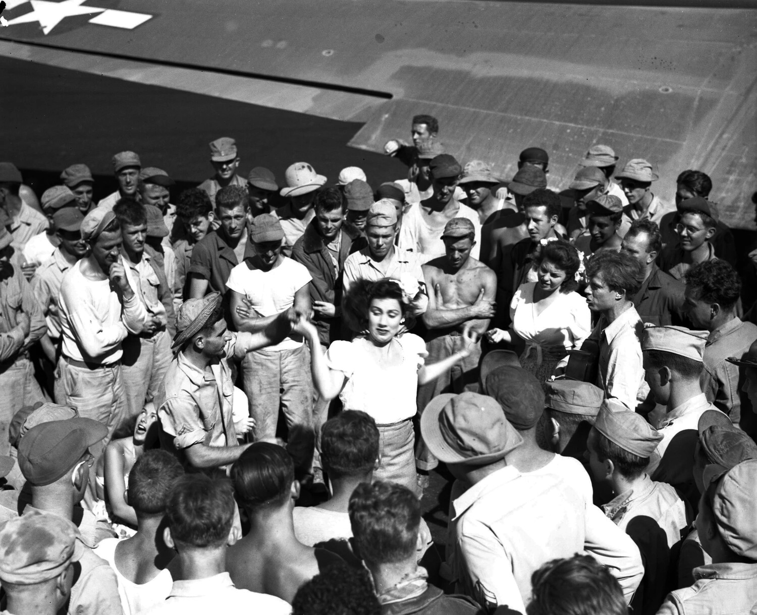 USO Entertainers Perform for Troops Under Aircraft Wing, Myitkyina, Burma, WWII