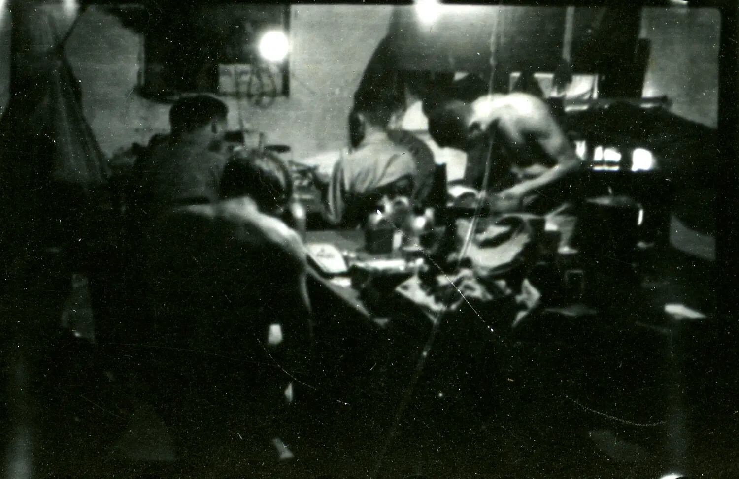 Servicemen Working at a Table in a Tent or Hut Interior, CBI Theater, WWII