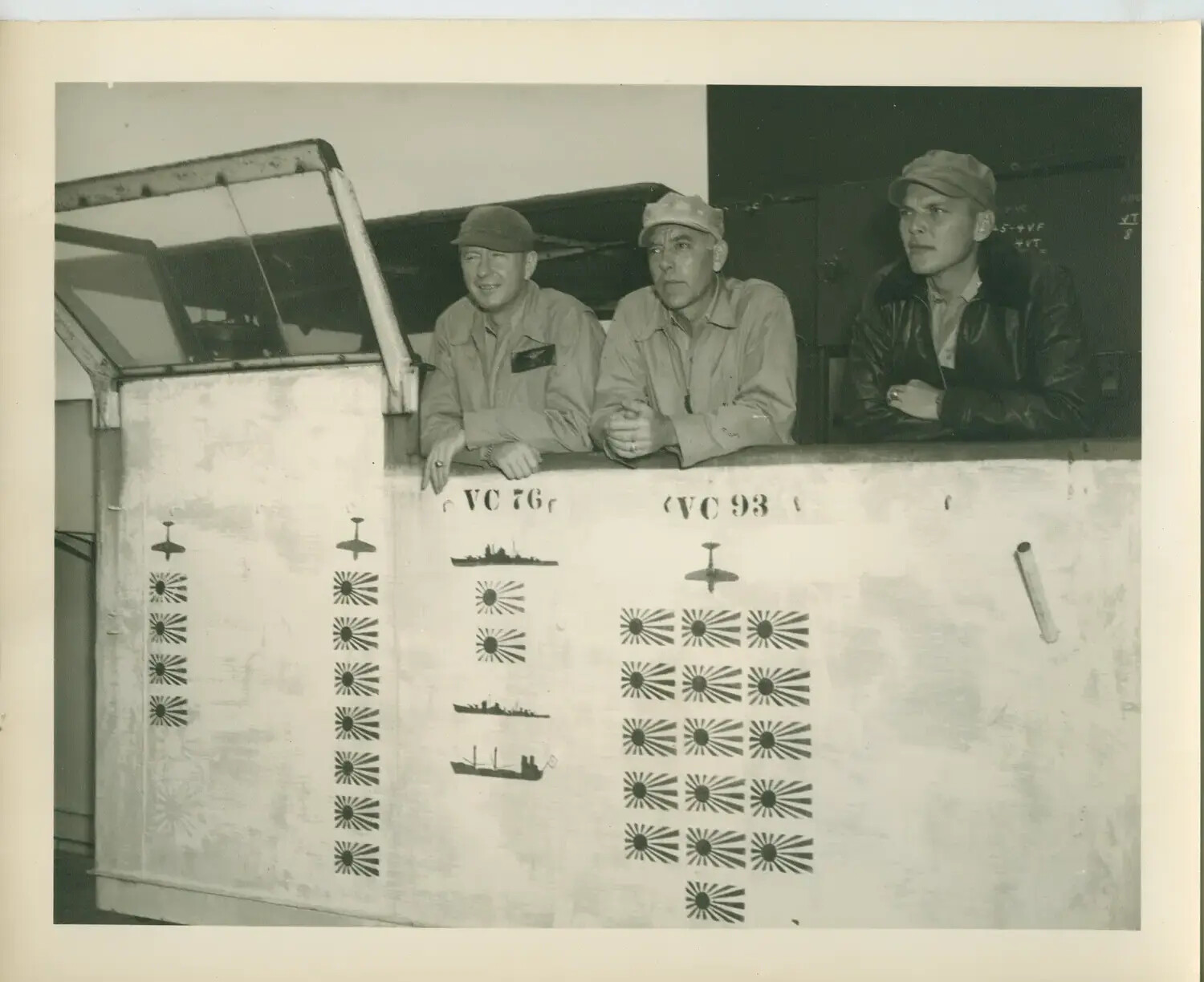 Naval Aviators Beside Kill-Marking Scoreboard, USS Petrof Bay (CVE-80)