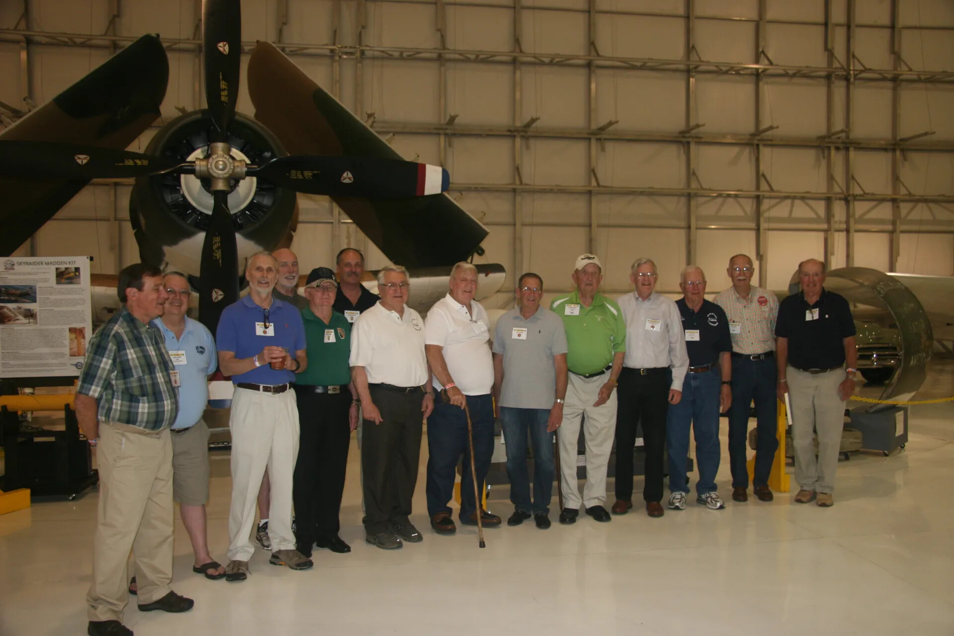 Fourteen-Man Group Photo Beneath A-1 Skyraider, Unedited Source Frame