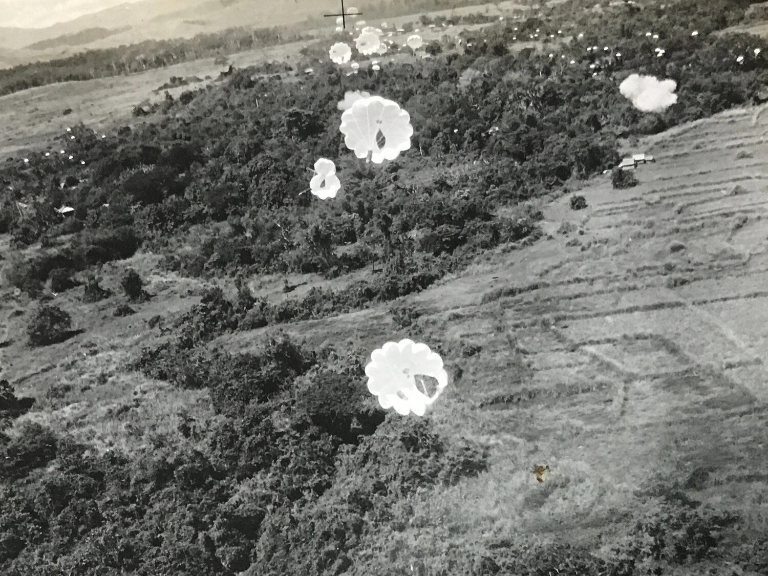 Parachutes Descending Over Jungle Highlands, 312th Bomb Group Operations, Southwest Pacific Theater