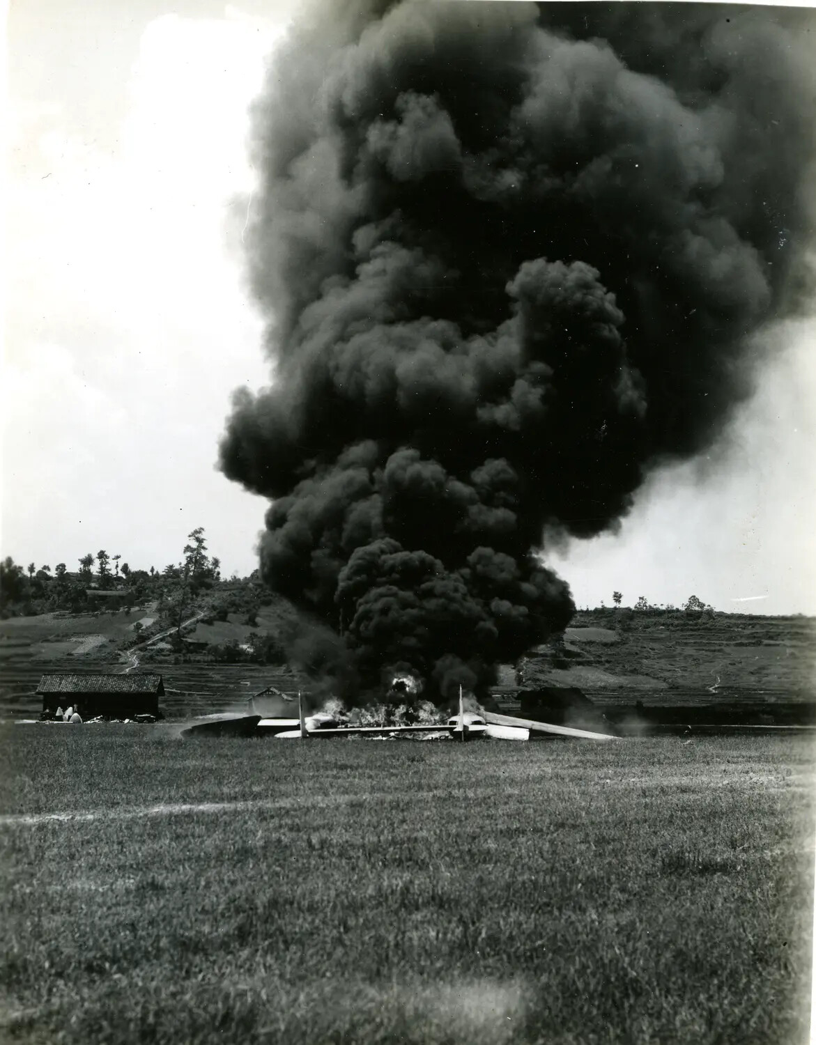 Crashed and Burning Military Aircraft in Rural China-Burma-India Theater Landscape, WWII