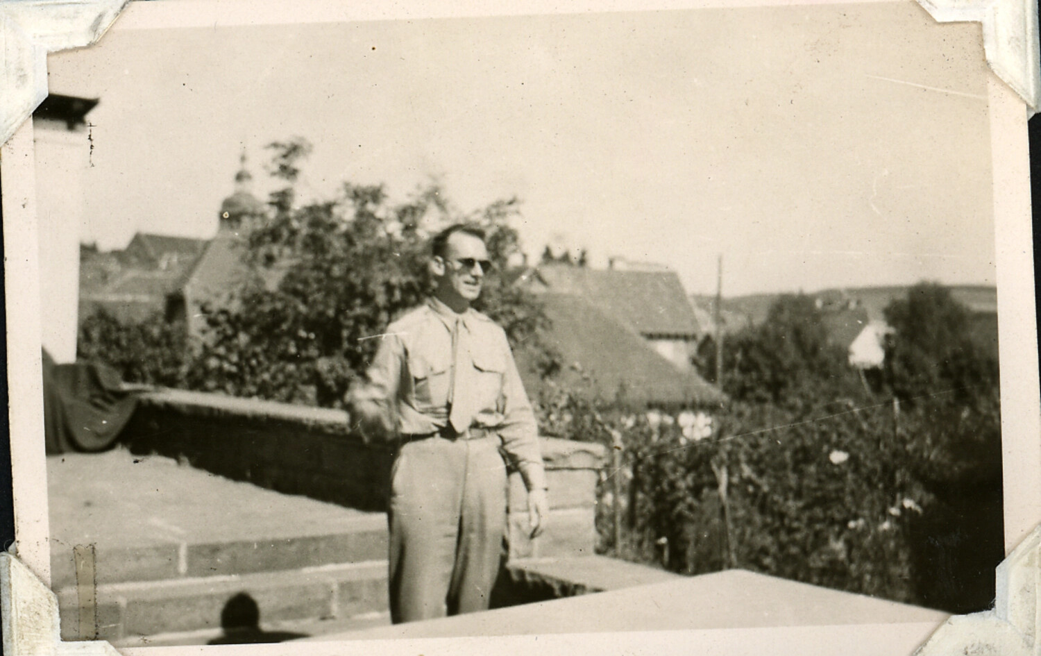 Serviceman on Rooftop Terrace Overlooking European Village, Personal Photo Album