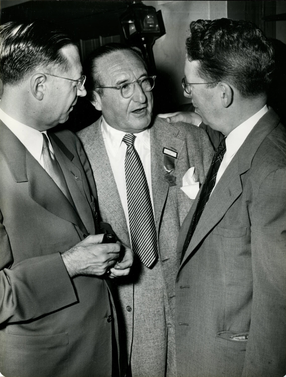 Close Conversation Among Three Attendees at Veterans' Convention, Late 1940s