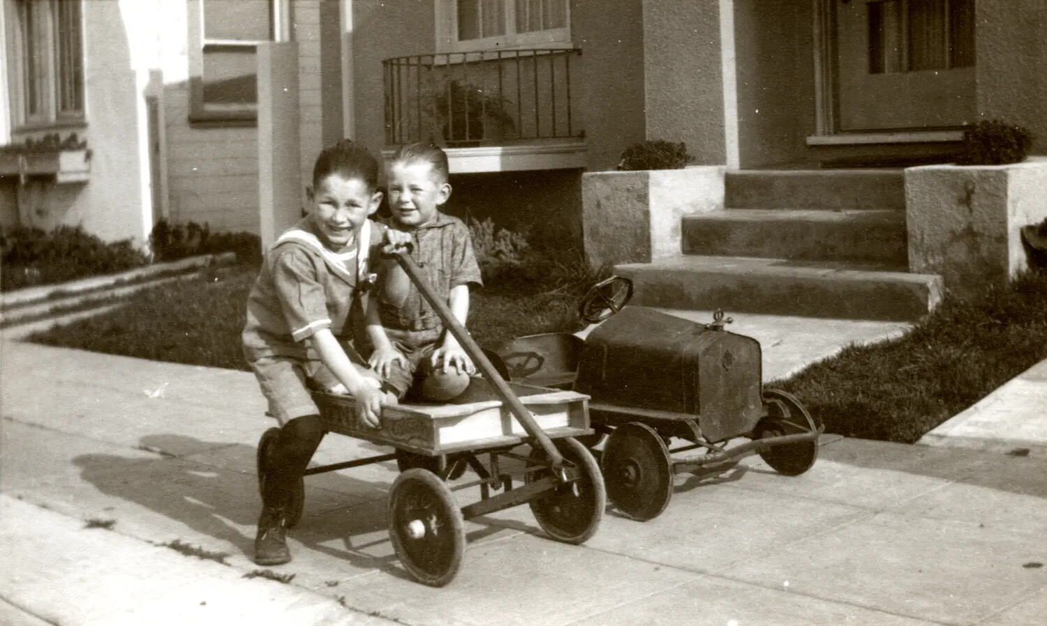 Two Boys with Coaster Wagon and Toy Pedal Car, Residential Street, Late 1920s-1930s (Family Snapshot, China-Burma-India Archive Collection)