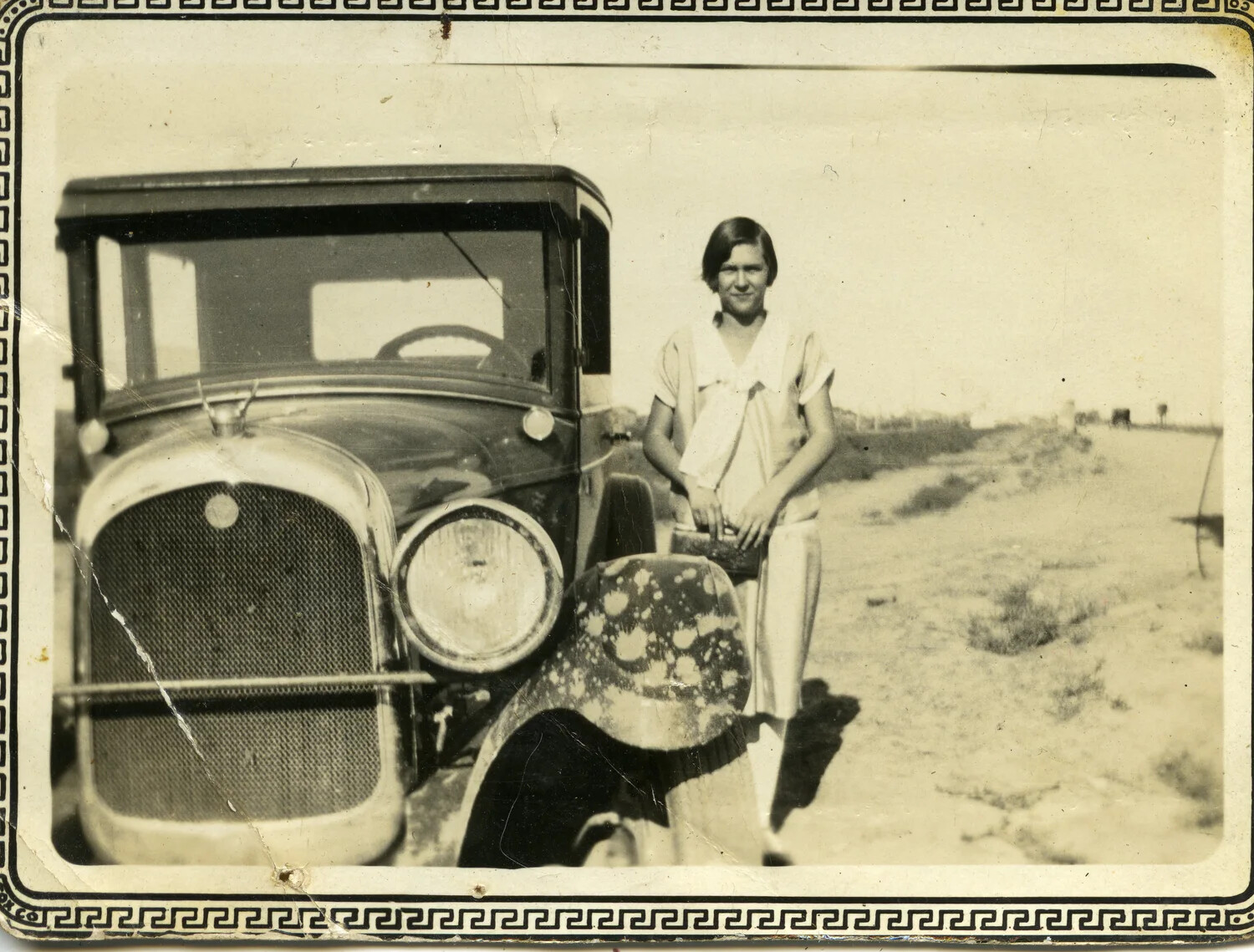 Woman Posing Beside an Automobile in a Rural Desert Landscape, Late 1920s