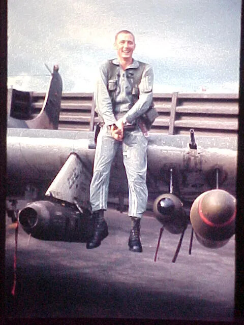 Airman Seated on A-1 Skyraider Wing at Da Nang Air Base