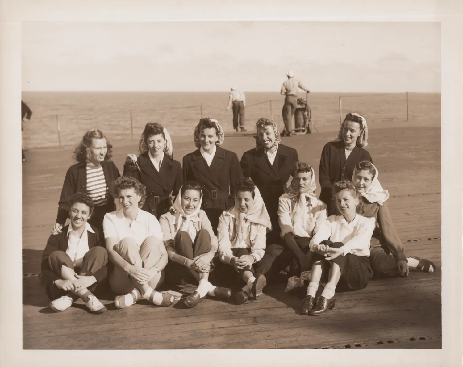 Group Portrait of Civilian Women on Flight Deck During Shakedown Cruise, U.S. Navy Escort Carrier, World War II