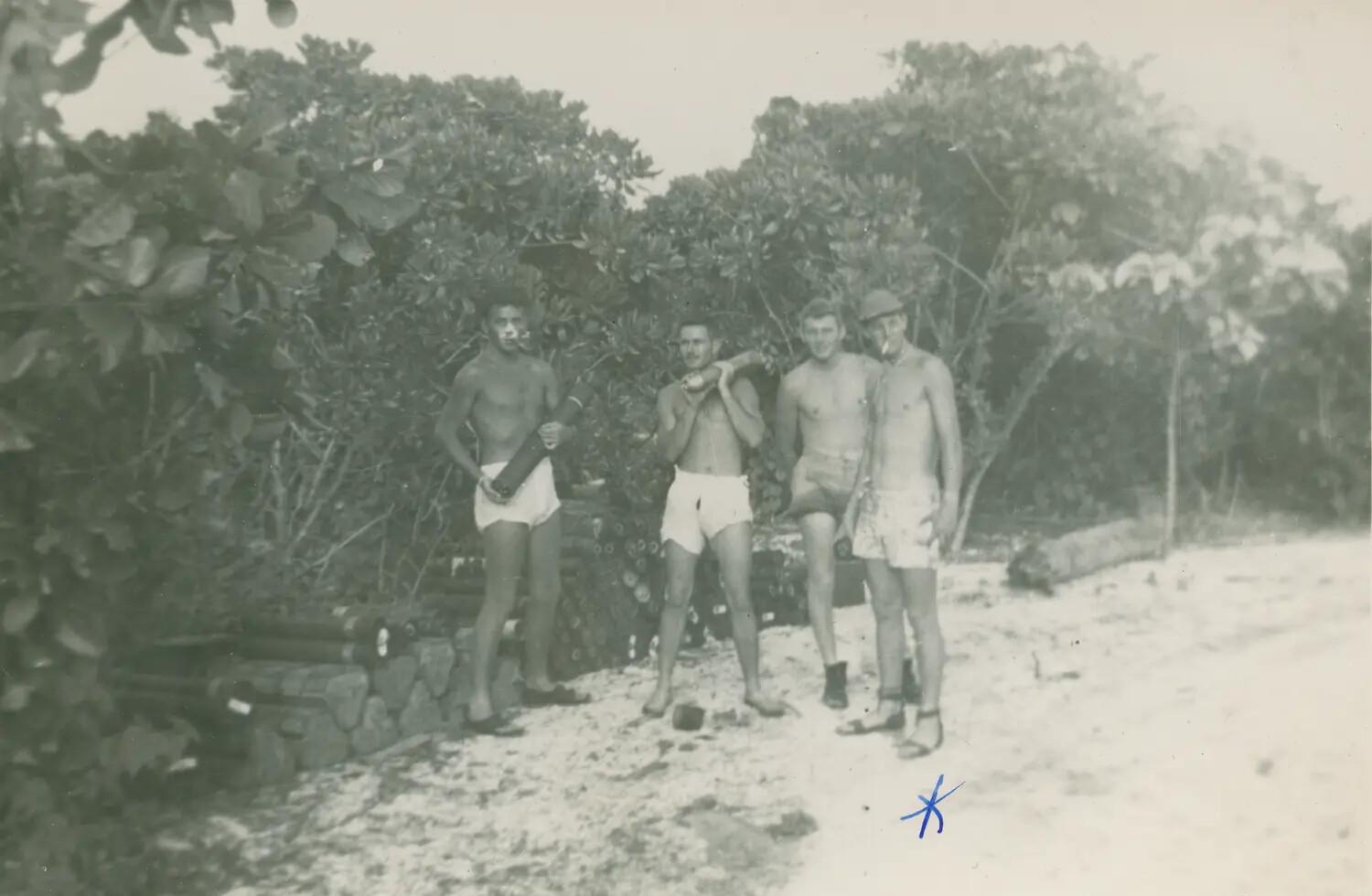 Four Servicemen at Leisure Beside Ammunition Stores, Pacific Island Base (McAleer Collection)