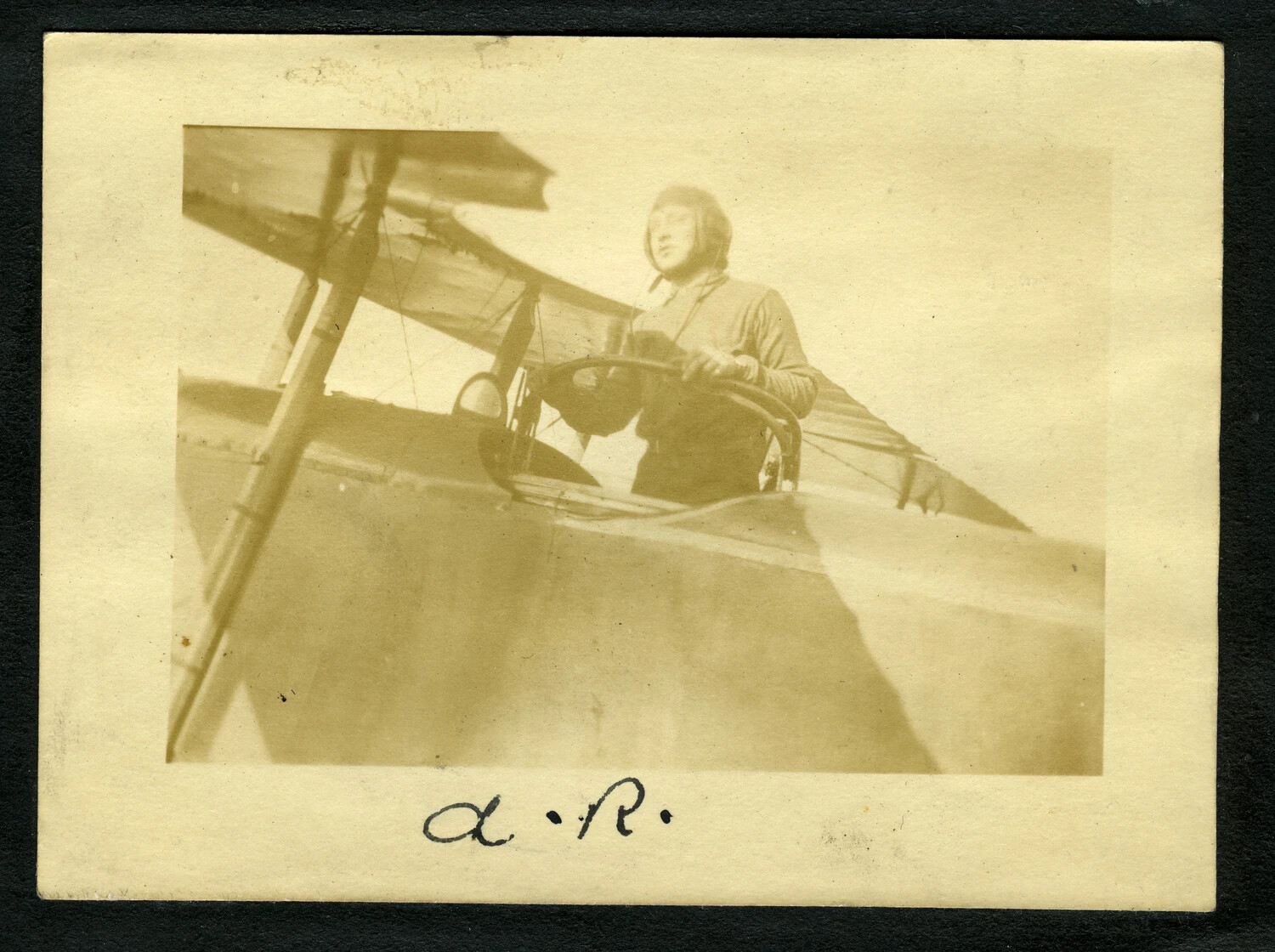 Aviator Standing in Cockpit of WWI-Era Biplane, Photo Album Page