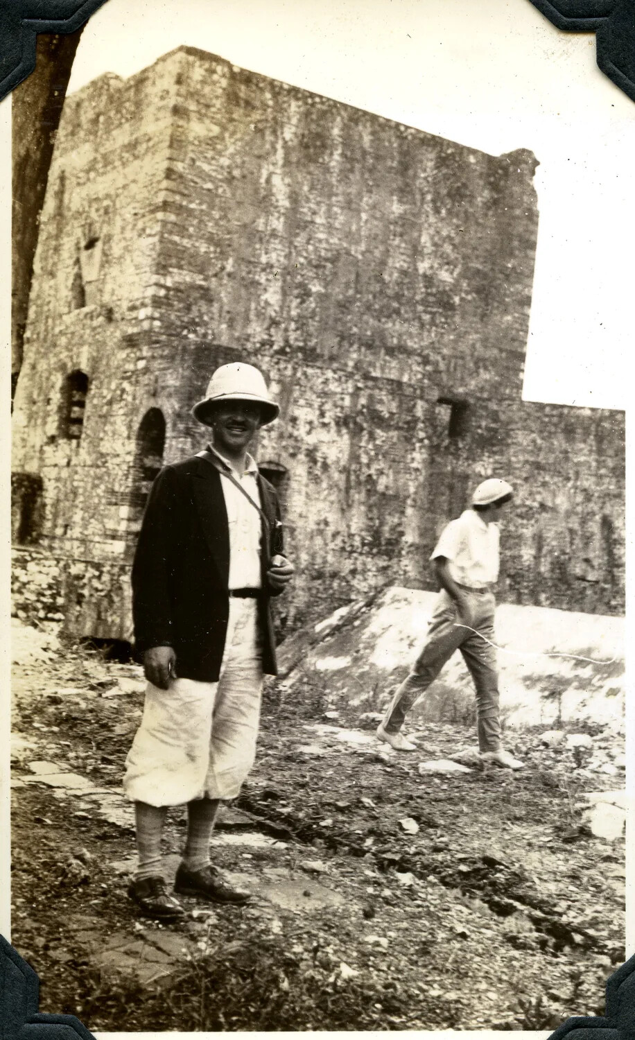 Two Men in Tropical Attire Before Historic Stone Fortification, Jervey Signal Corps Album