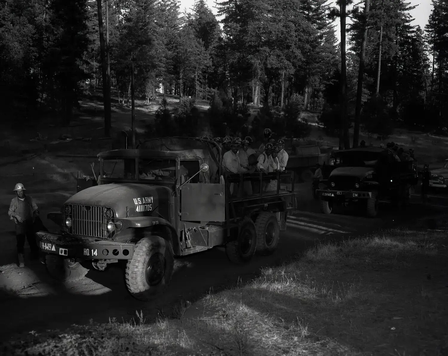 U.S. Army Truck Convoy Transporting Firefighting Crew Through Forest, National Guard Wildfire Support Operation