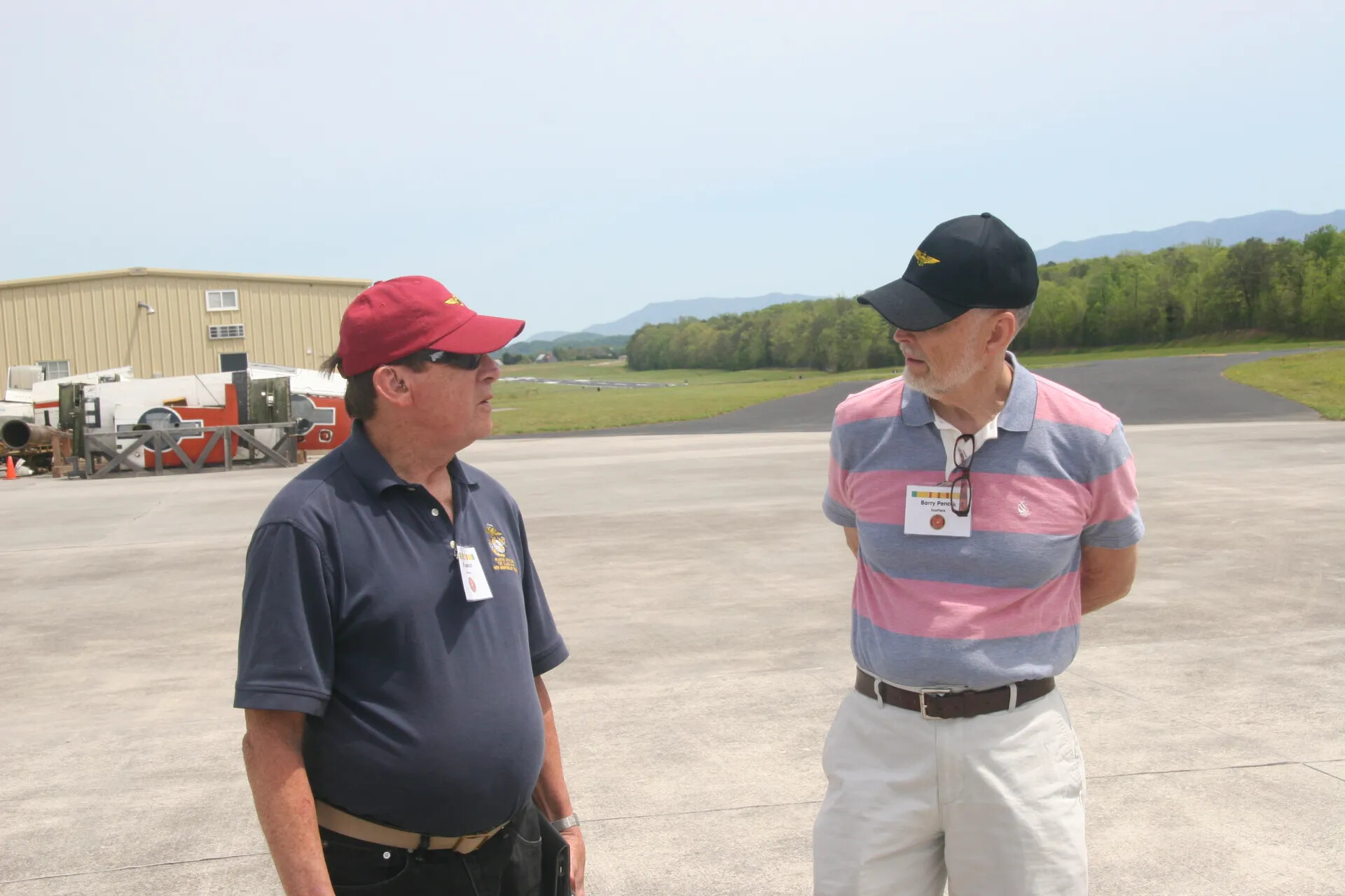 Two Reunion Attendees Conversing on Airport Ramp, Operation Tailwind Event