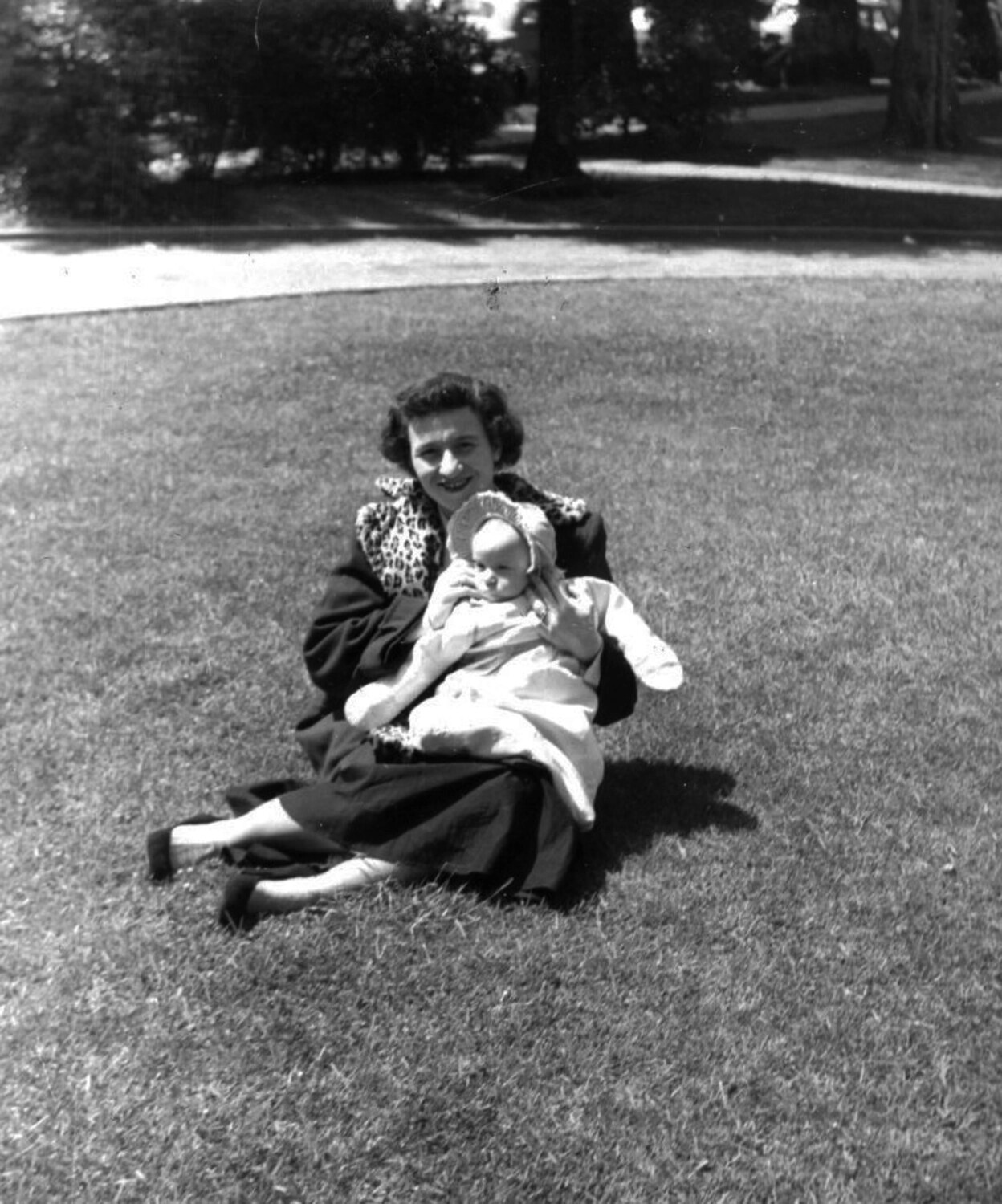Woman with Infant Seated on Lawn, Home-Front Family Portrait (Bancroft Korean War-Era Collection)